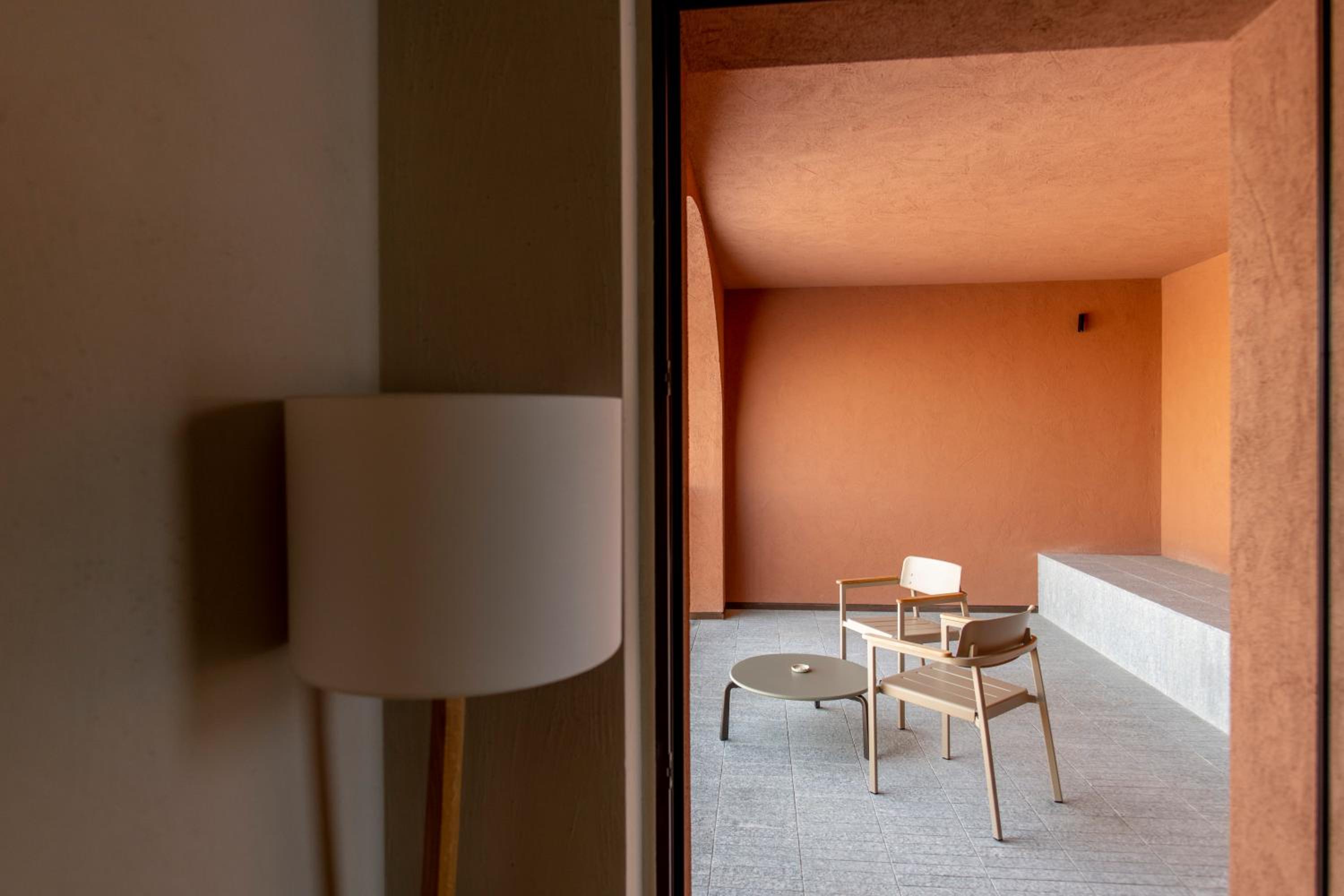chair and a table in the corner of a room
