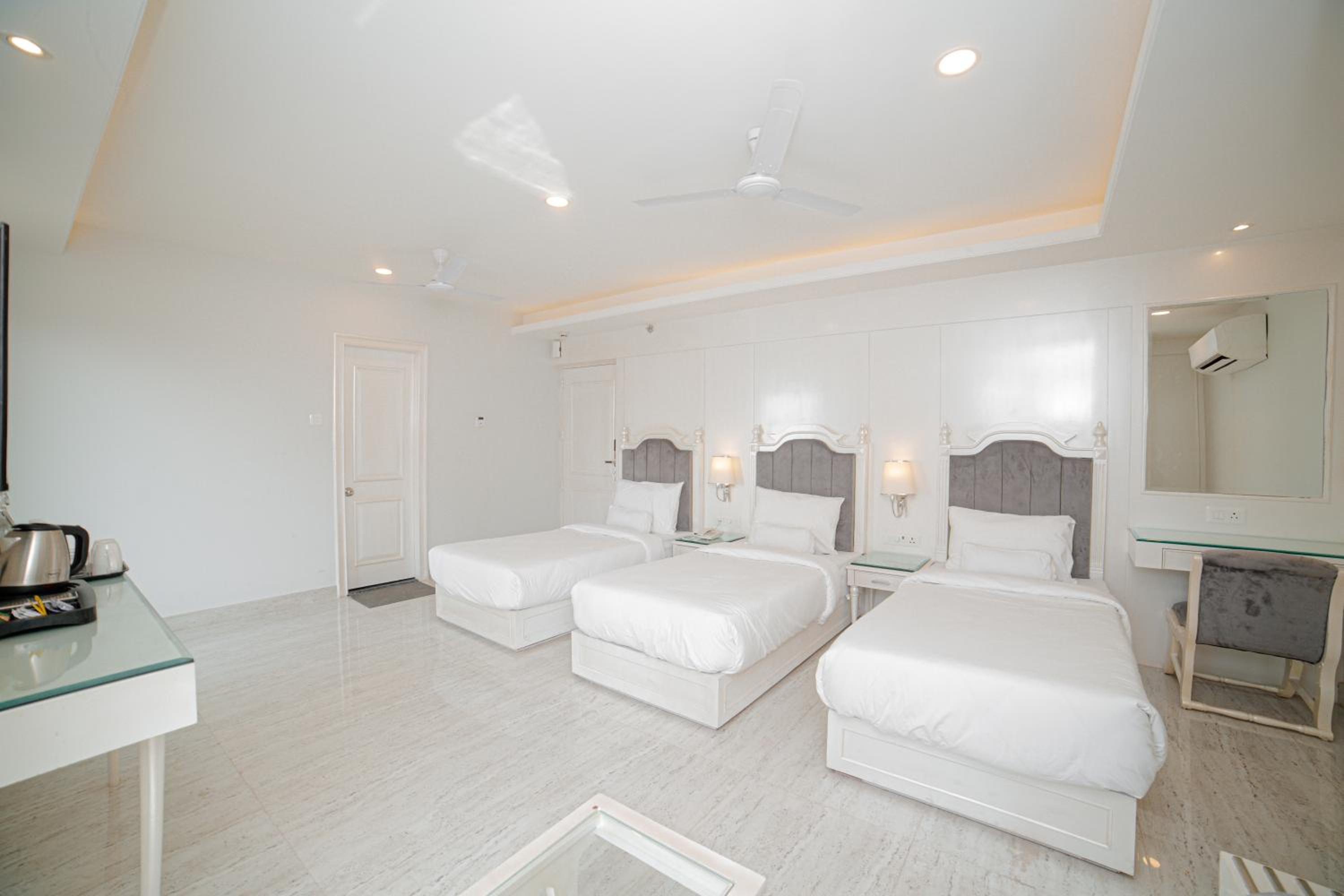 Triple Room with 10% off on Two-way Airport/Railway/Bus Transfer and 20% Off on Laundry service for upto 2 clothing items