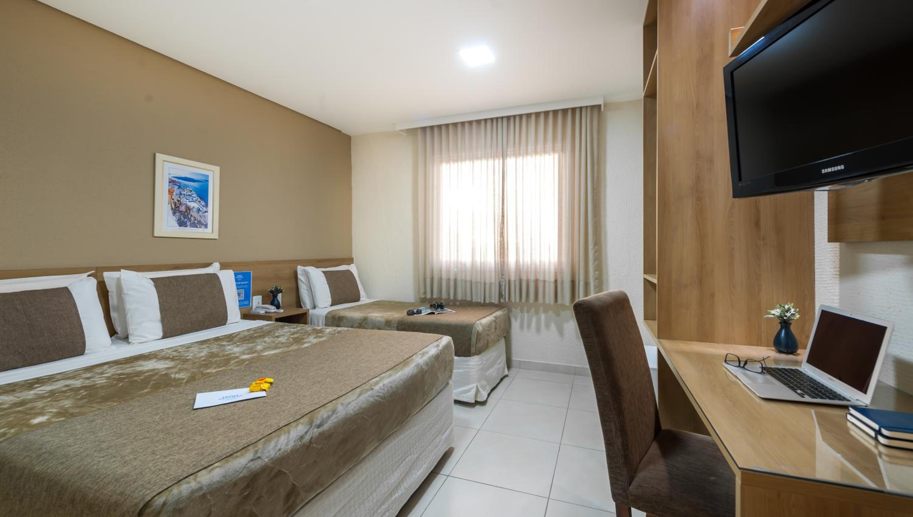 Deluxe Triple Room (1 Double + 1 Single Bed) photo 2