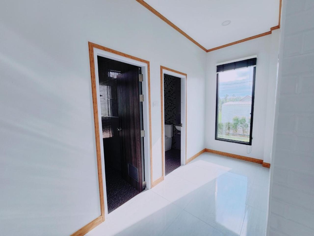 Three-Bedroom House - Photo 2