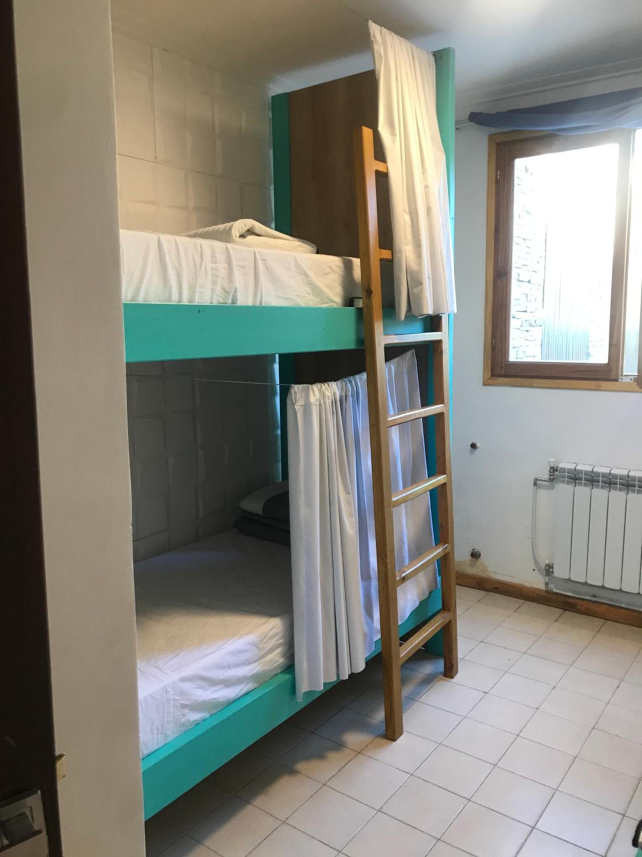 Single Bed in Dormitory Room