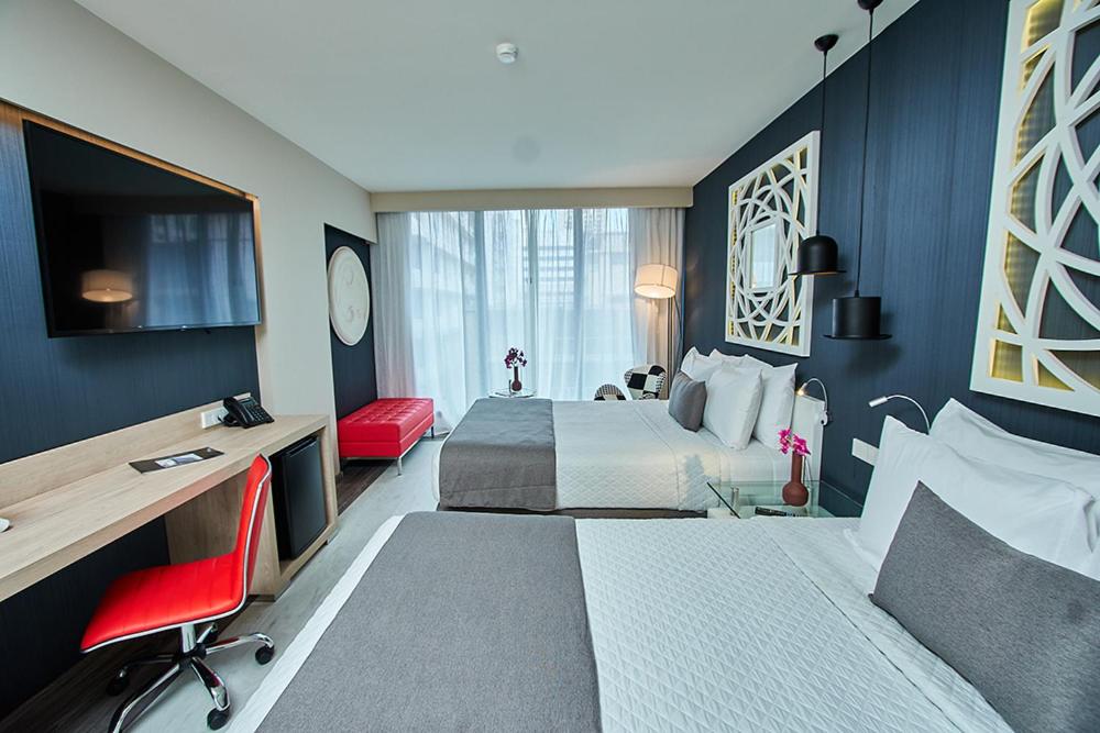 Deluxe Queen Room with Two Queen Beds - Photo 12