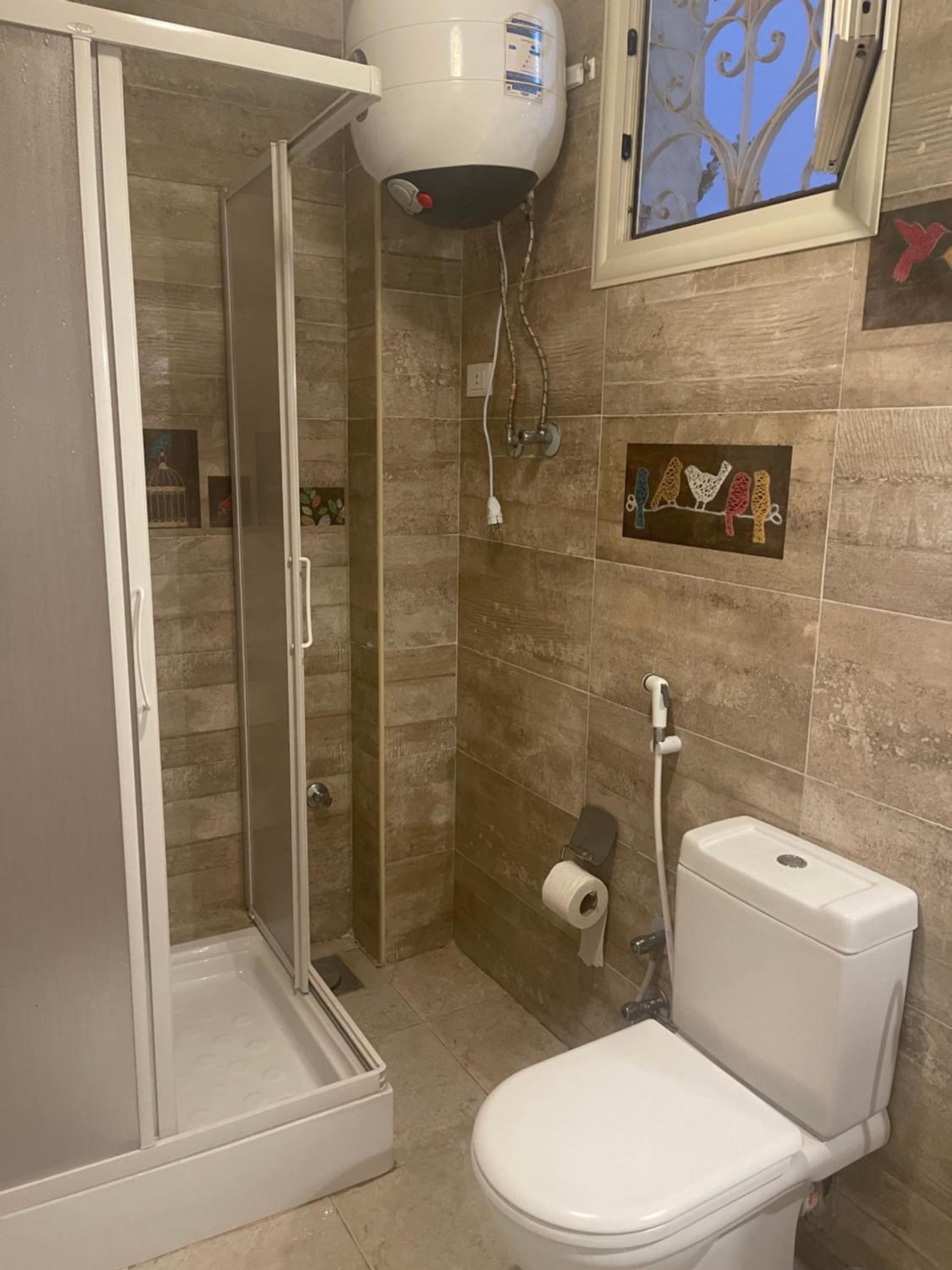 Three-Bedroom House - Photo 33