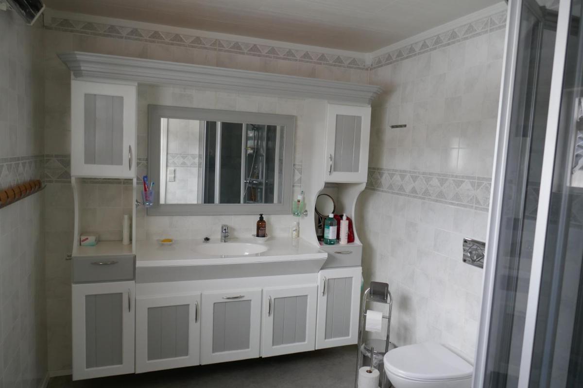 Three-Bedroom House - Photo 16