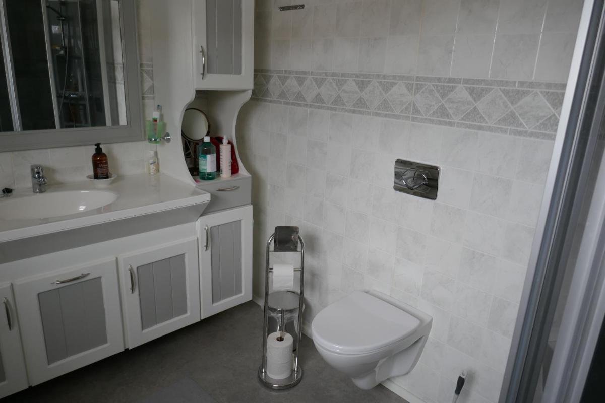 Three-Bedroom House - Photo 17