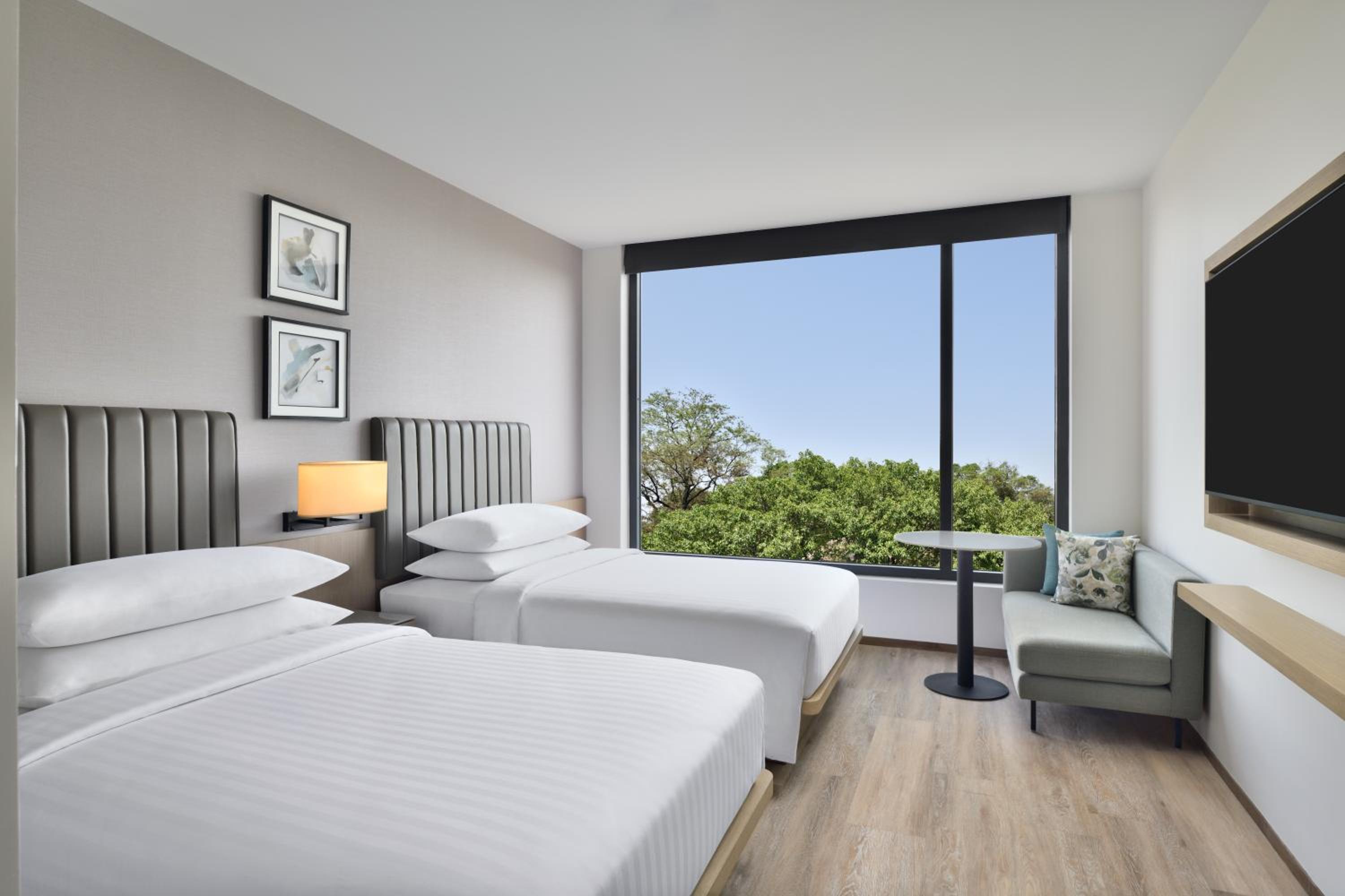 Premium Twin Room On Higher Floors With Welcome Amenities (Early Check in &Late Check out-subject to availability,10% off on Laundry )