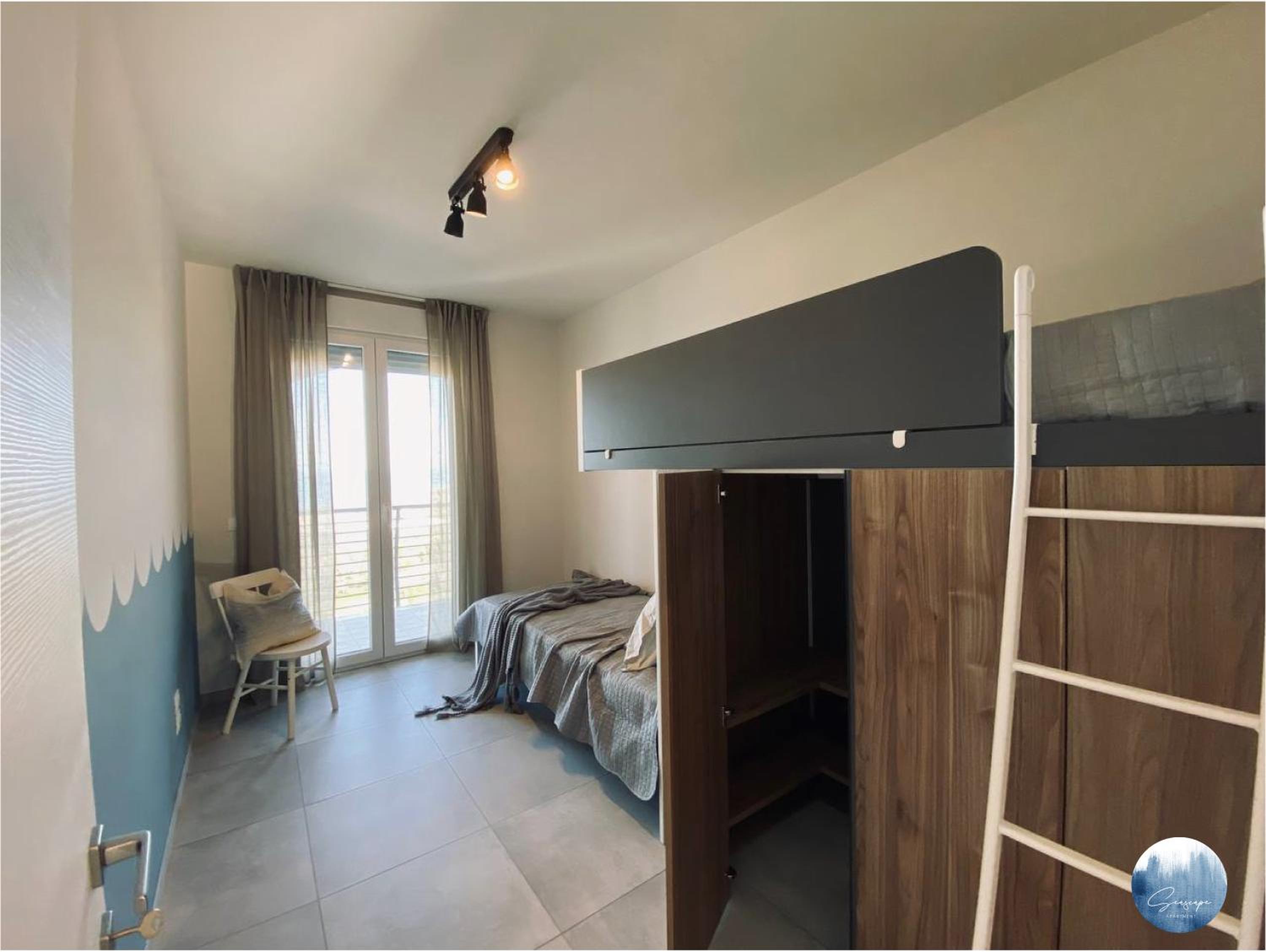 Three-Bedroom Apartment photo 1
