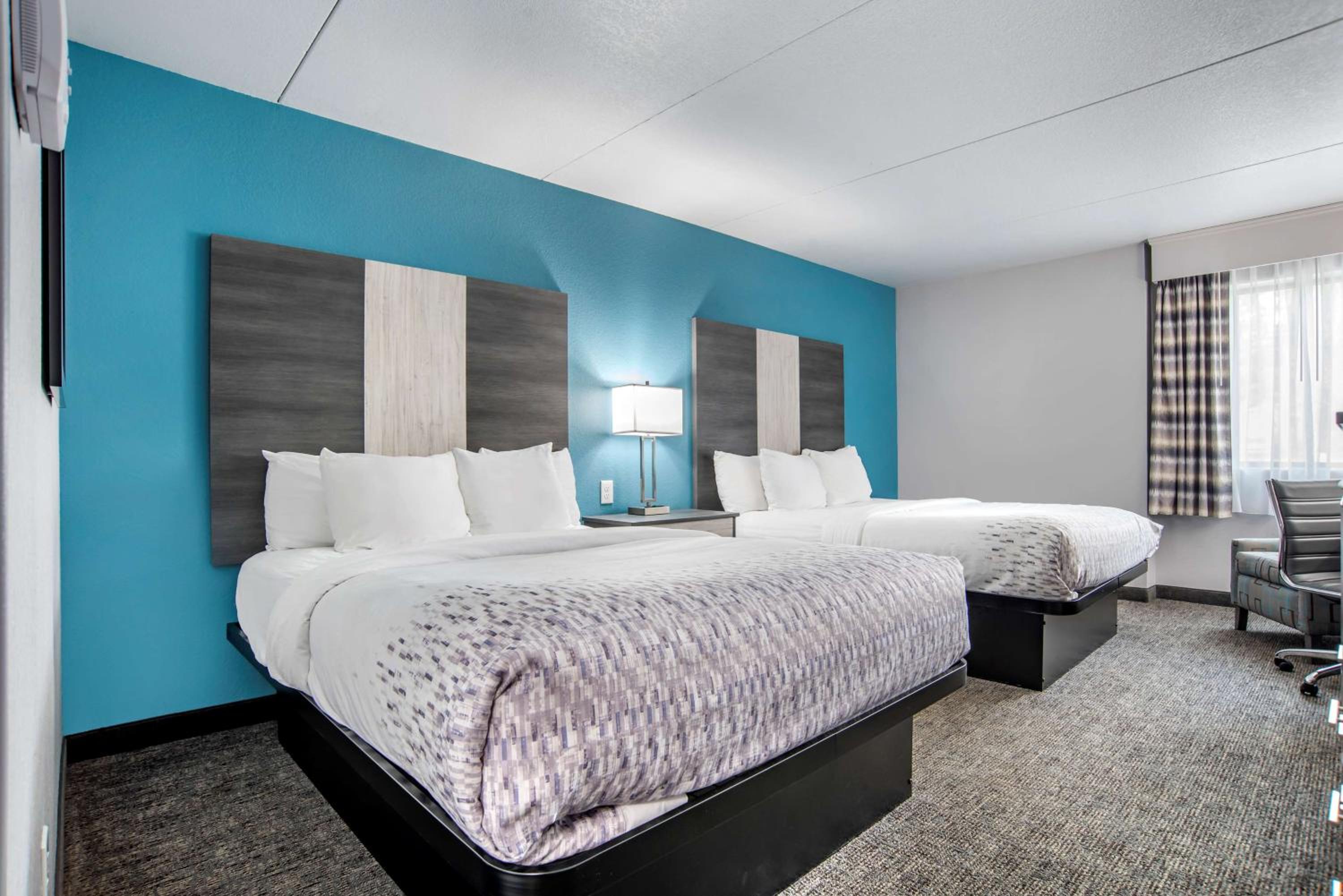 Queen Suite with Two Queen Beds and Sofa Bed - Non-Smoking - Photo 1