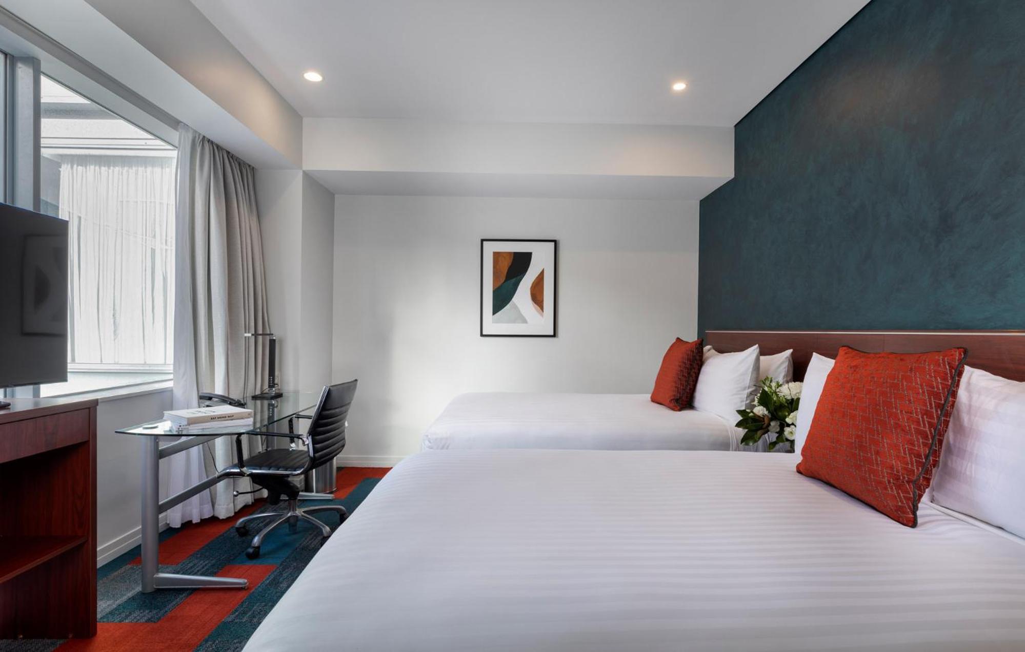 Deluxe Room with Two Double Beds and City View - Photo 2