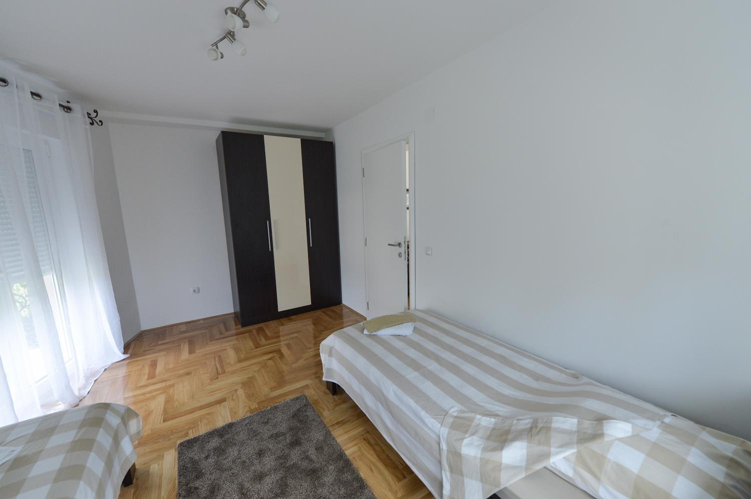Three-Bedroom Apartment with Balcony photo 2