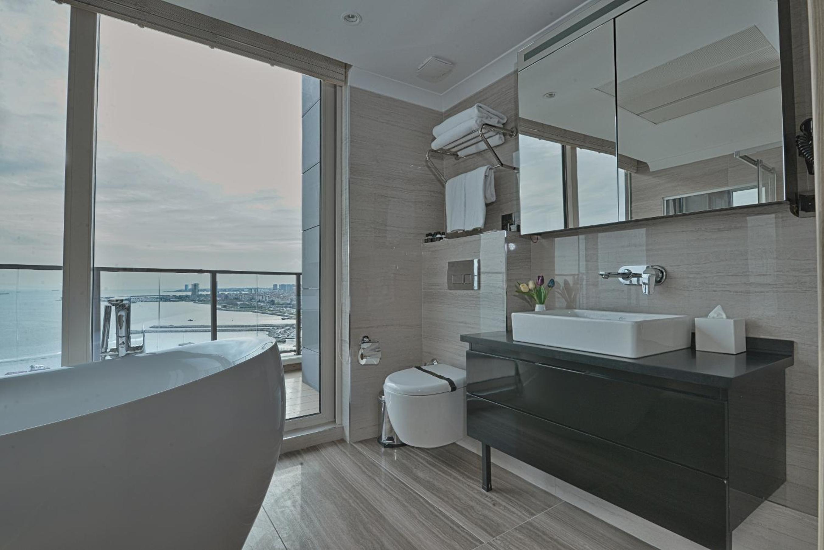 Duplex Suite with One Queen Bed and Two Single Beds with Balcony and View