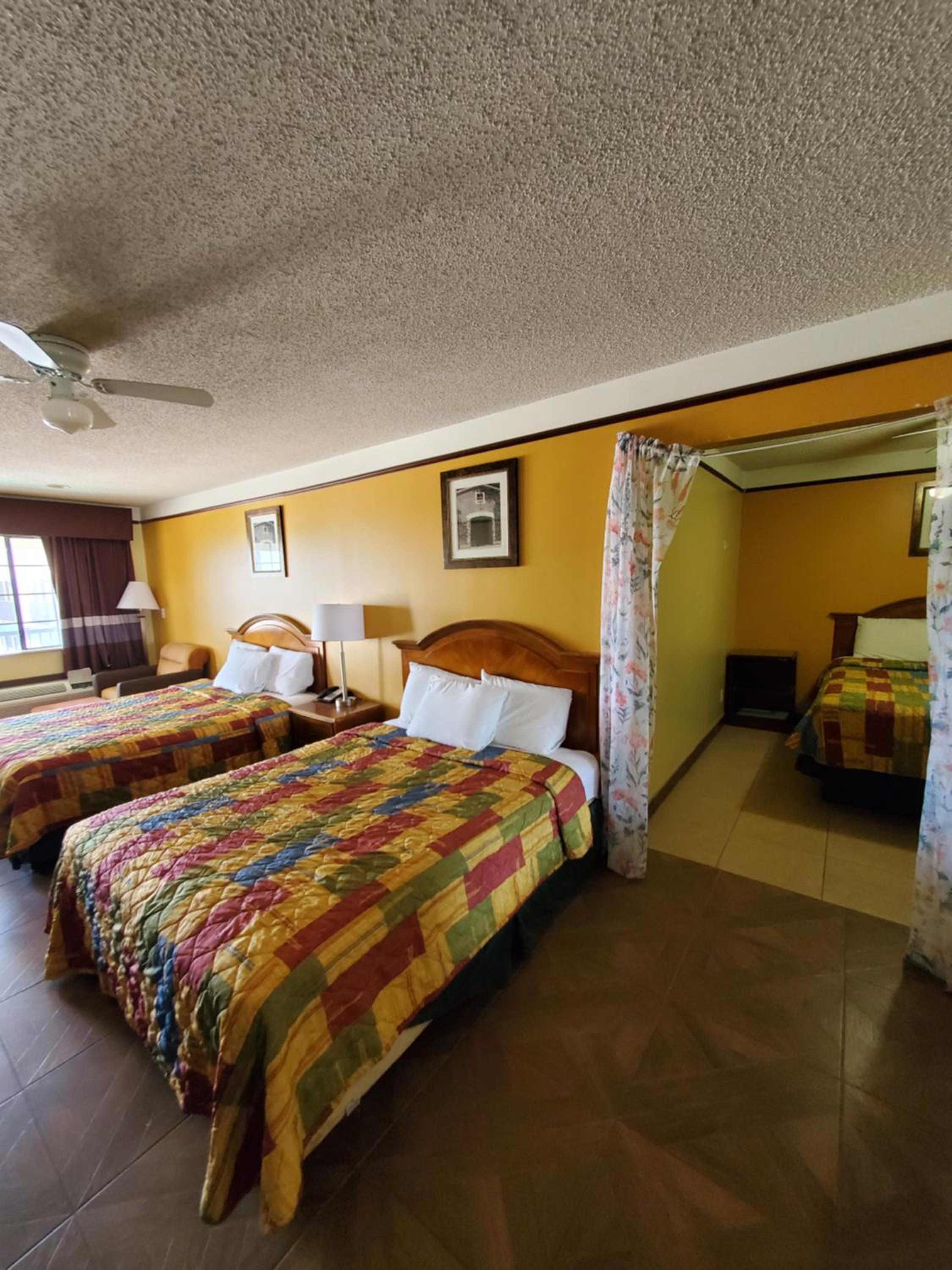 Queen Room with Three Queen Beds - Photo 6