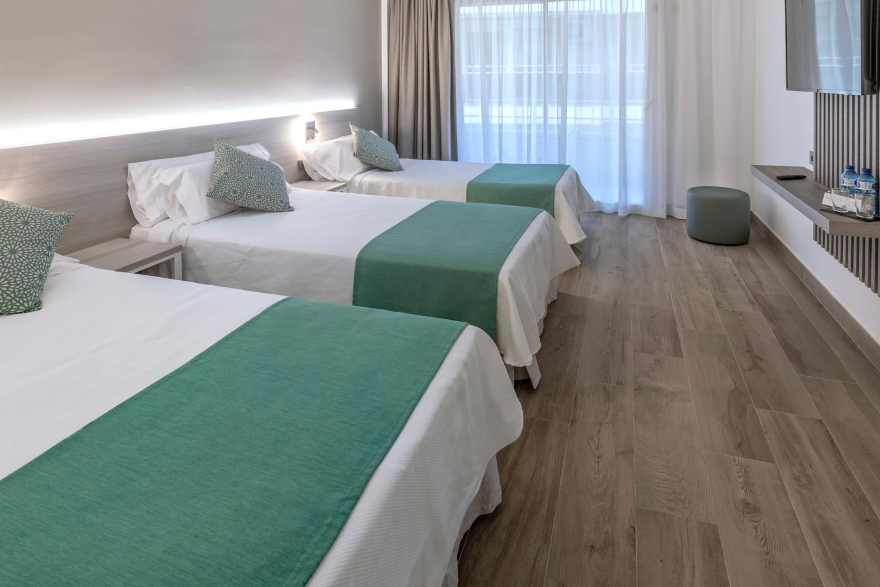 Economy Triple Room (2 Adults + 1 Child) - Photo 1