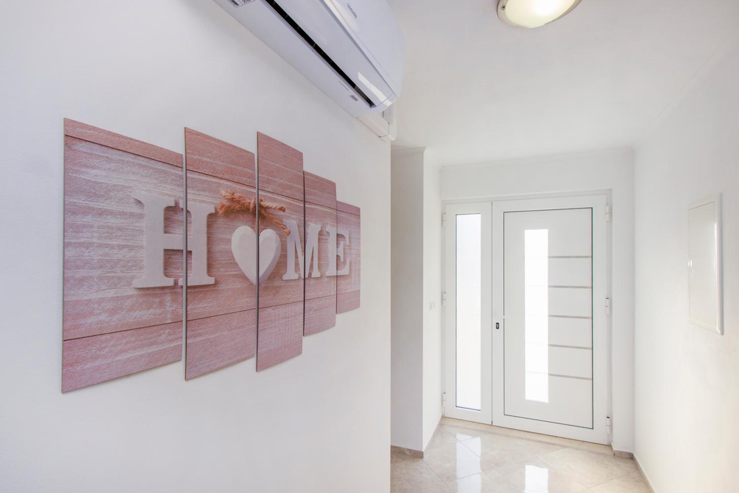 Three-Bedroom House - Photo 28
