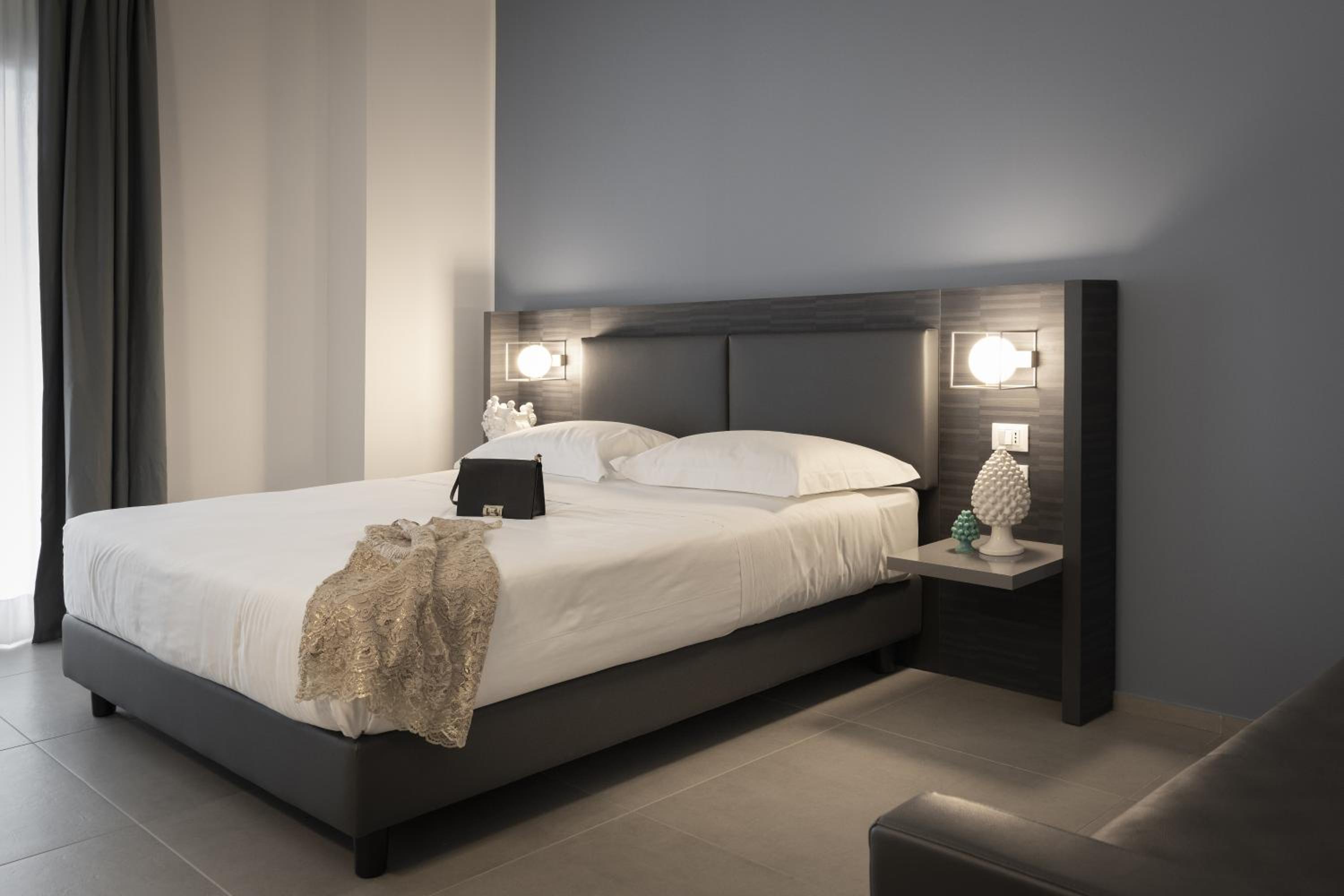 Deluxe Quadruple Room with Terrace and Sea View - Photo 1