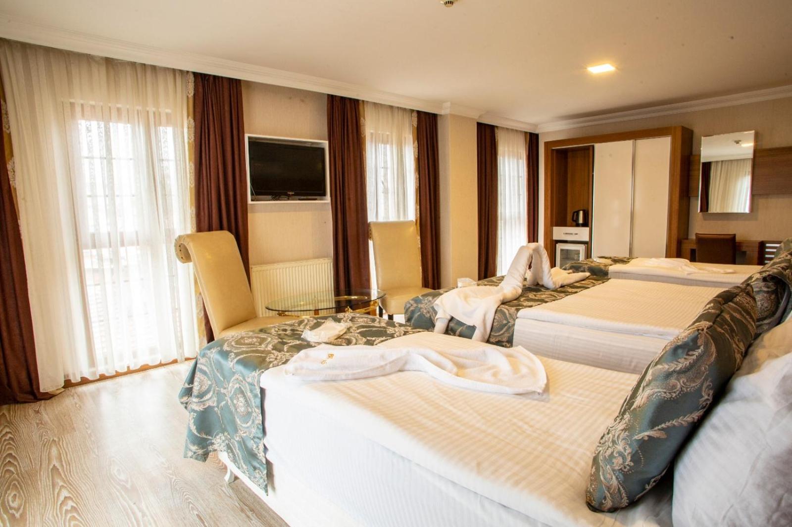 Deluxe Quadruple Room - Photo 2