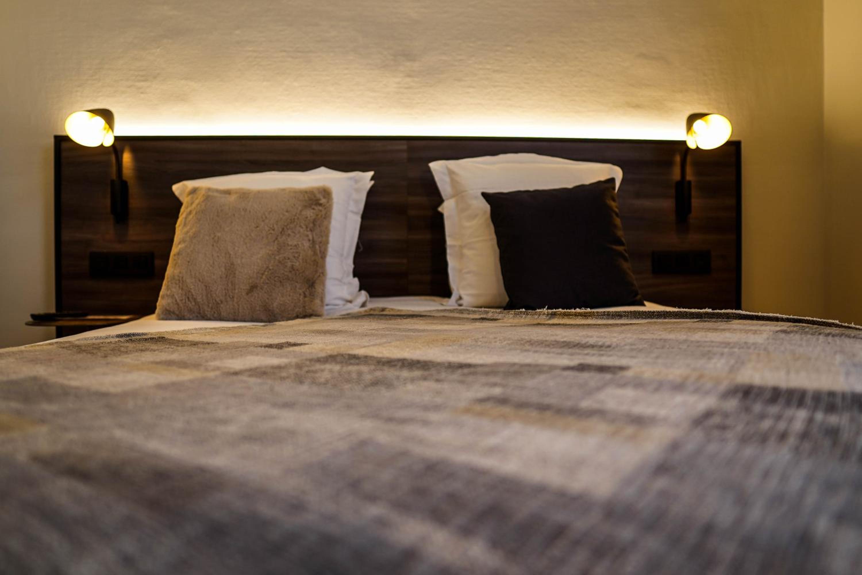 close up of a bed with two pillows on it