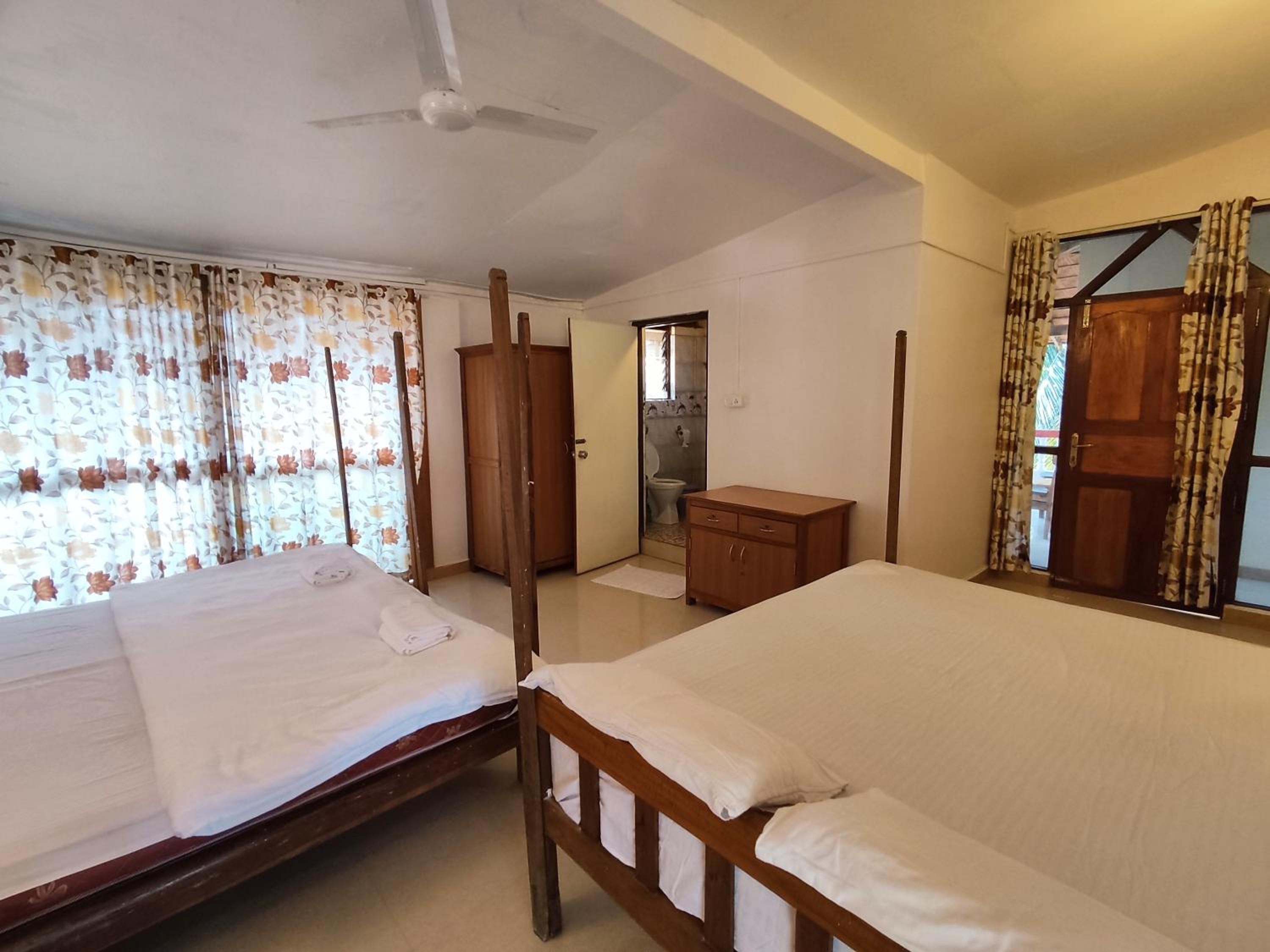 Queen Room with Two Queen Beds - Photo 1
