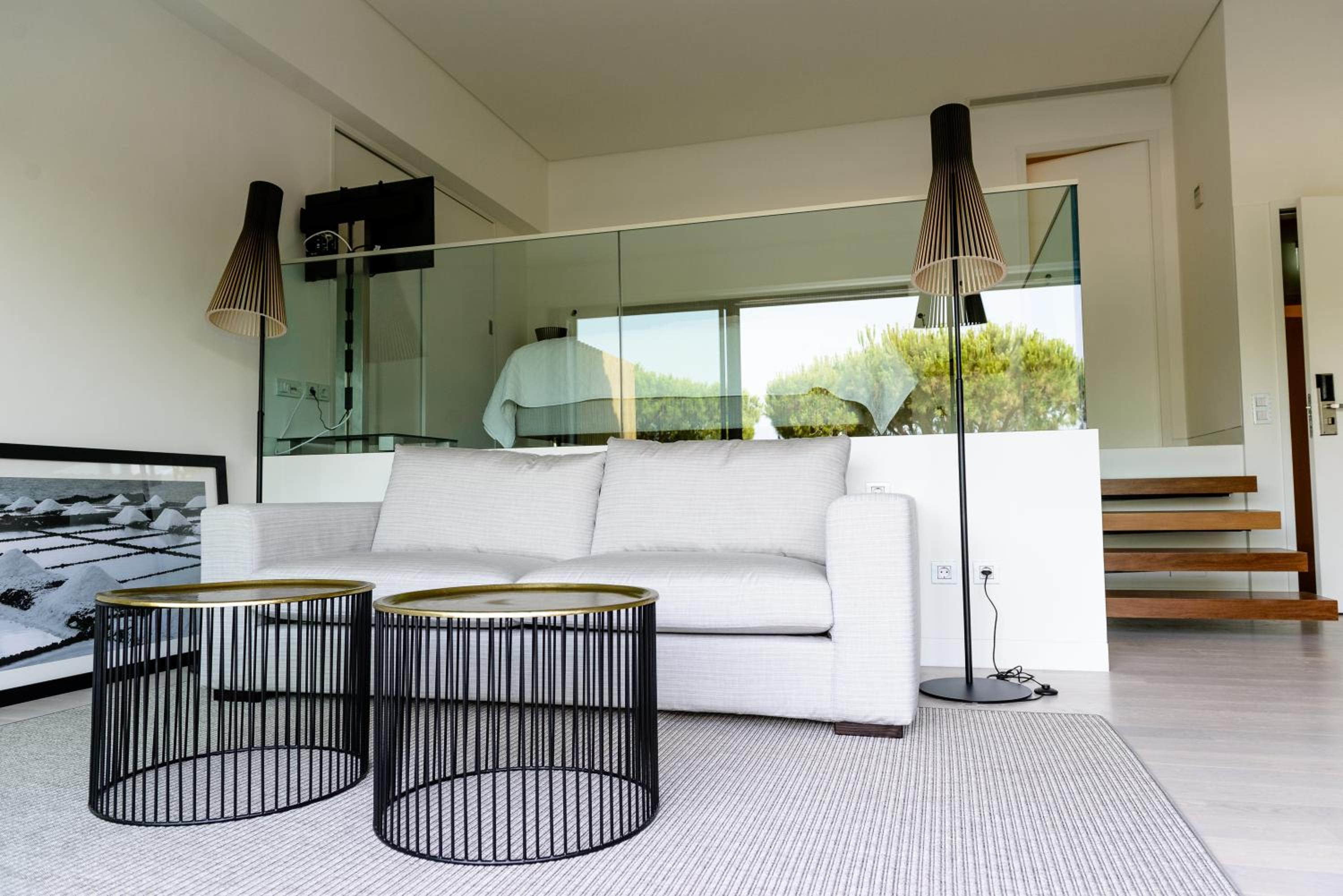 living room with a white couch and two side tables