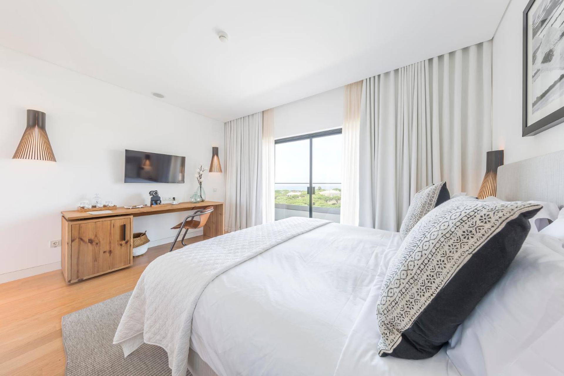 bedroom with a large bed and a flat screen tv