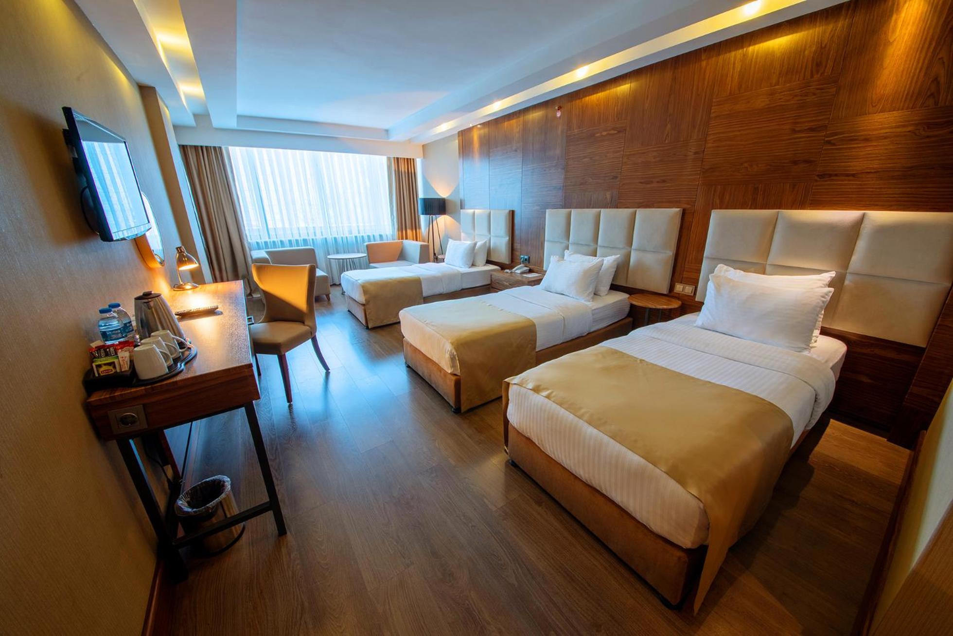 Deluxe Triple Room - Photo 1