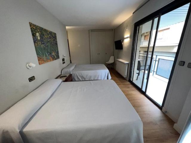 Habitación Cuádruple con Vista al Jardín