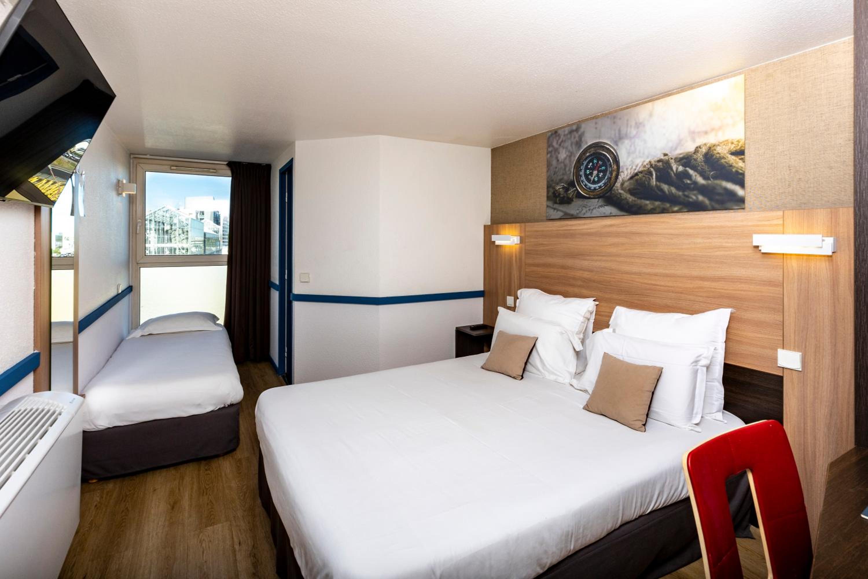 Triple Room With 1 Double Bed And 1 Single Bed