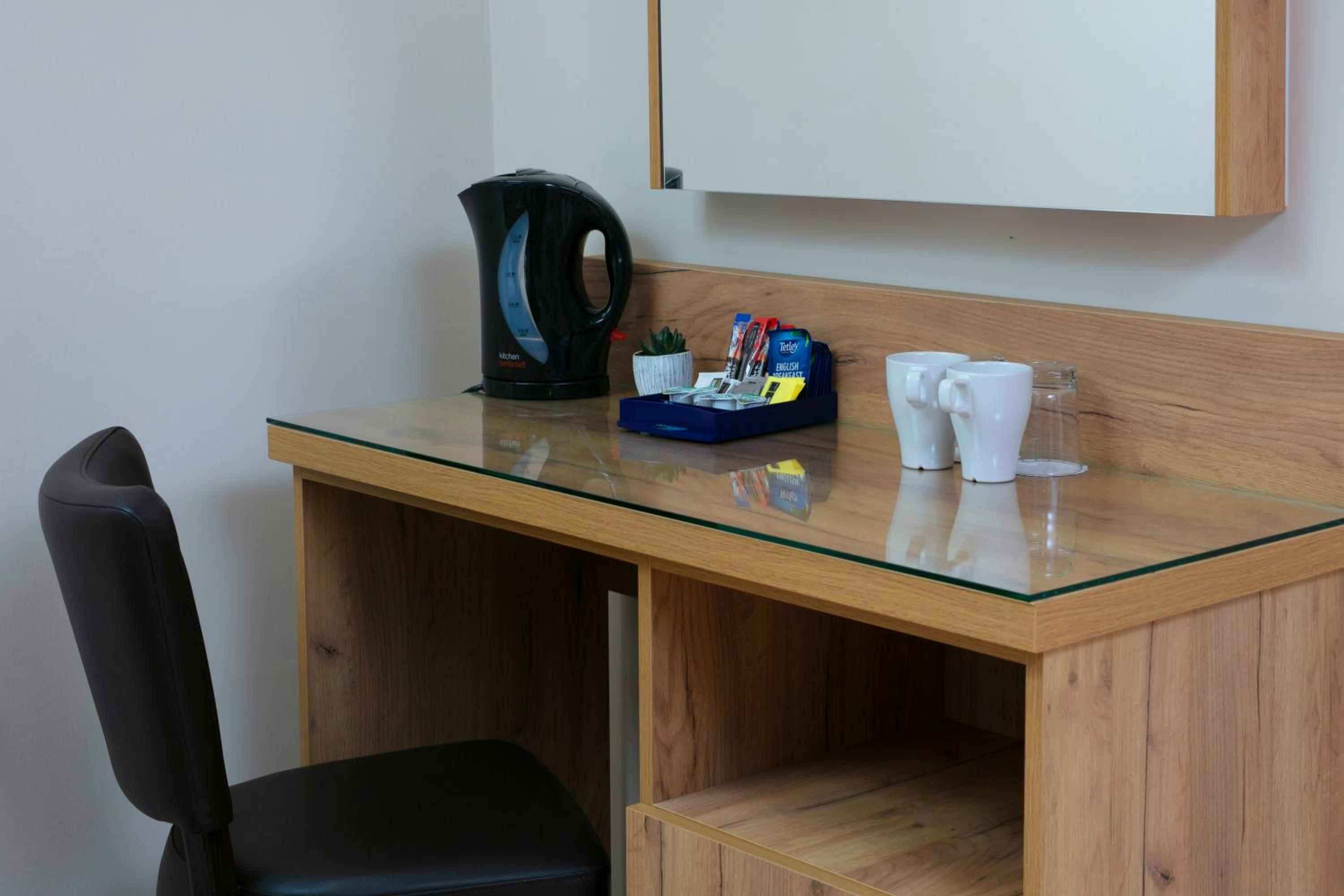 Superior Family Room with One King and Two Single Beds and Kitchenette - Non-Smoking photo 1