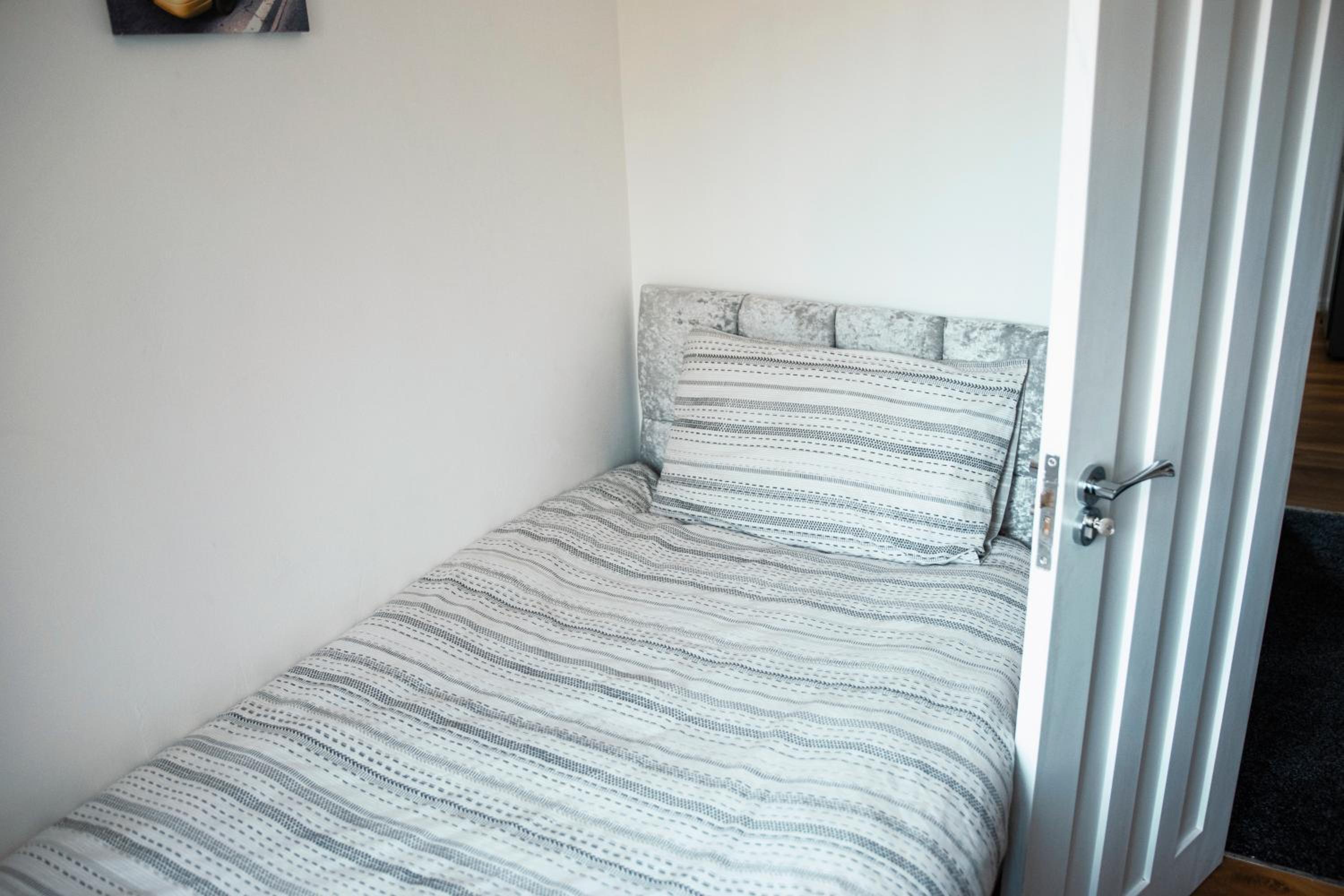 Three-Bedroom House - Photo 31