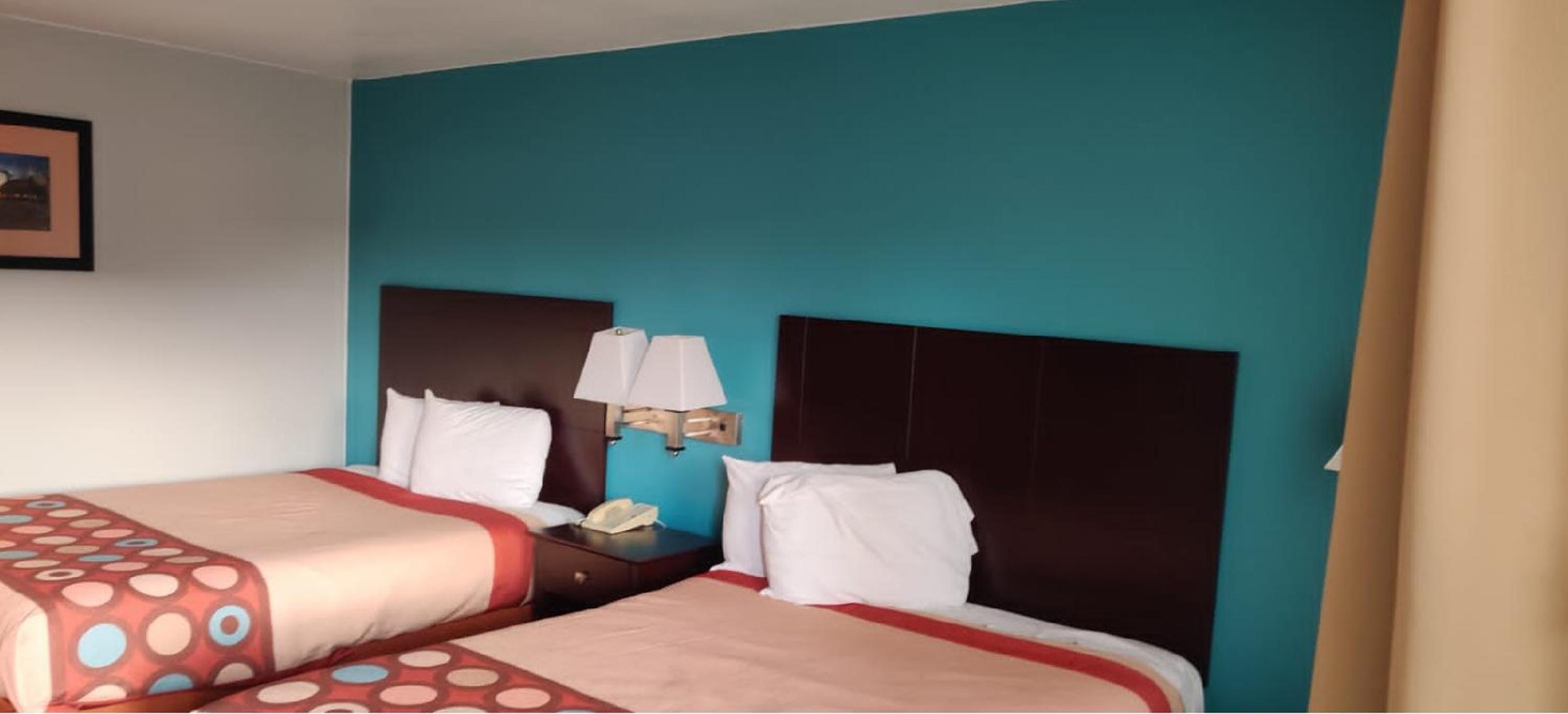 Queen Room with Two Queen Beds - Smoking - Photo 1