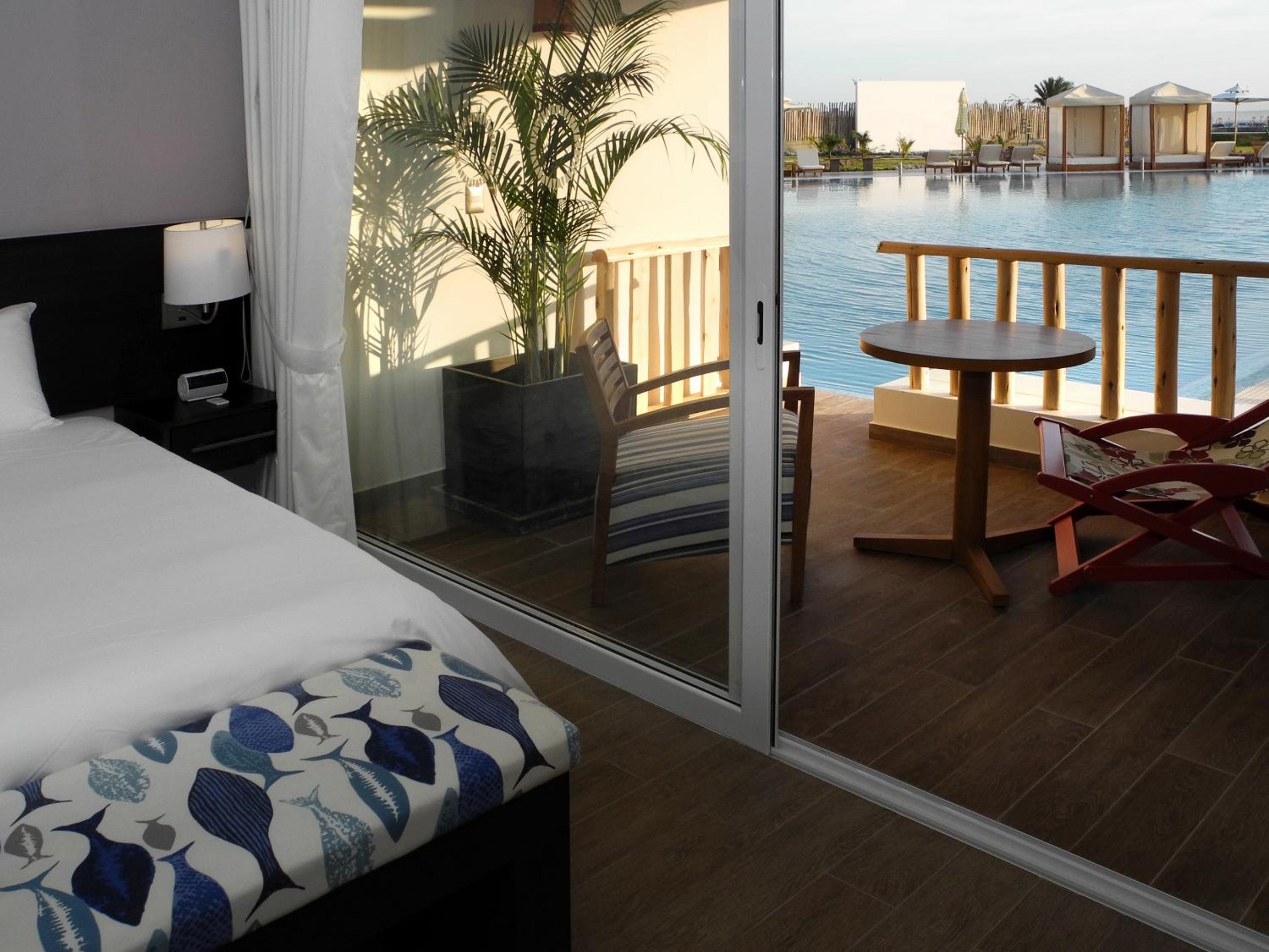 Deluxe Room with Two Queen Beds and Pool Access photo 1