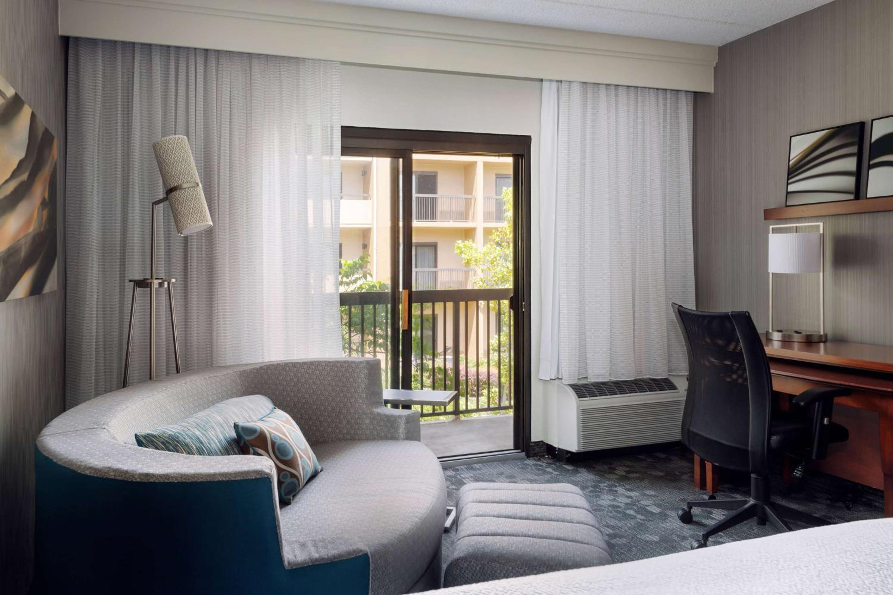 King Room with Sofabed, Balcony and Courtyard View - Photo 1