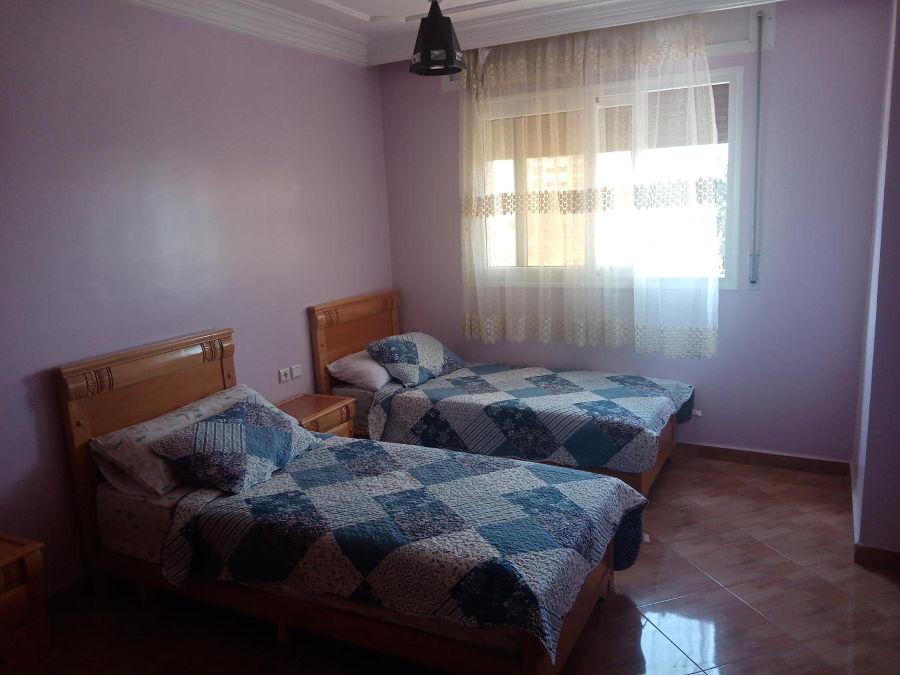 Three-Bedroom Apartment - Photo 2