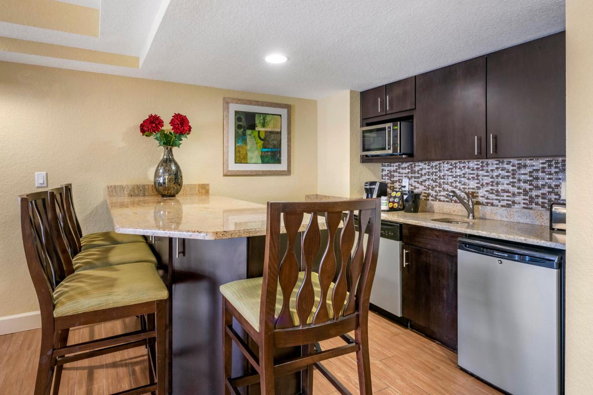 One-Bedroom Queen Suite with Two Queen Beds, Balcony and Pool View