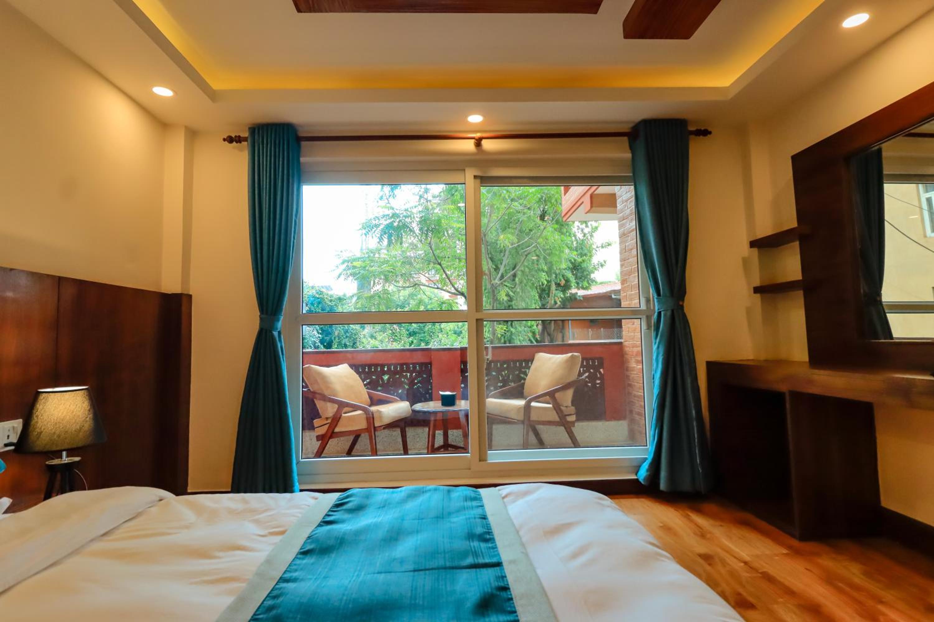 King Room with Private Balcony and Garden View - 10% off on Food & Beverage, 15% off on Laundry, Early check-in & Late check-out by 2 hours photo 3