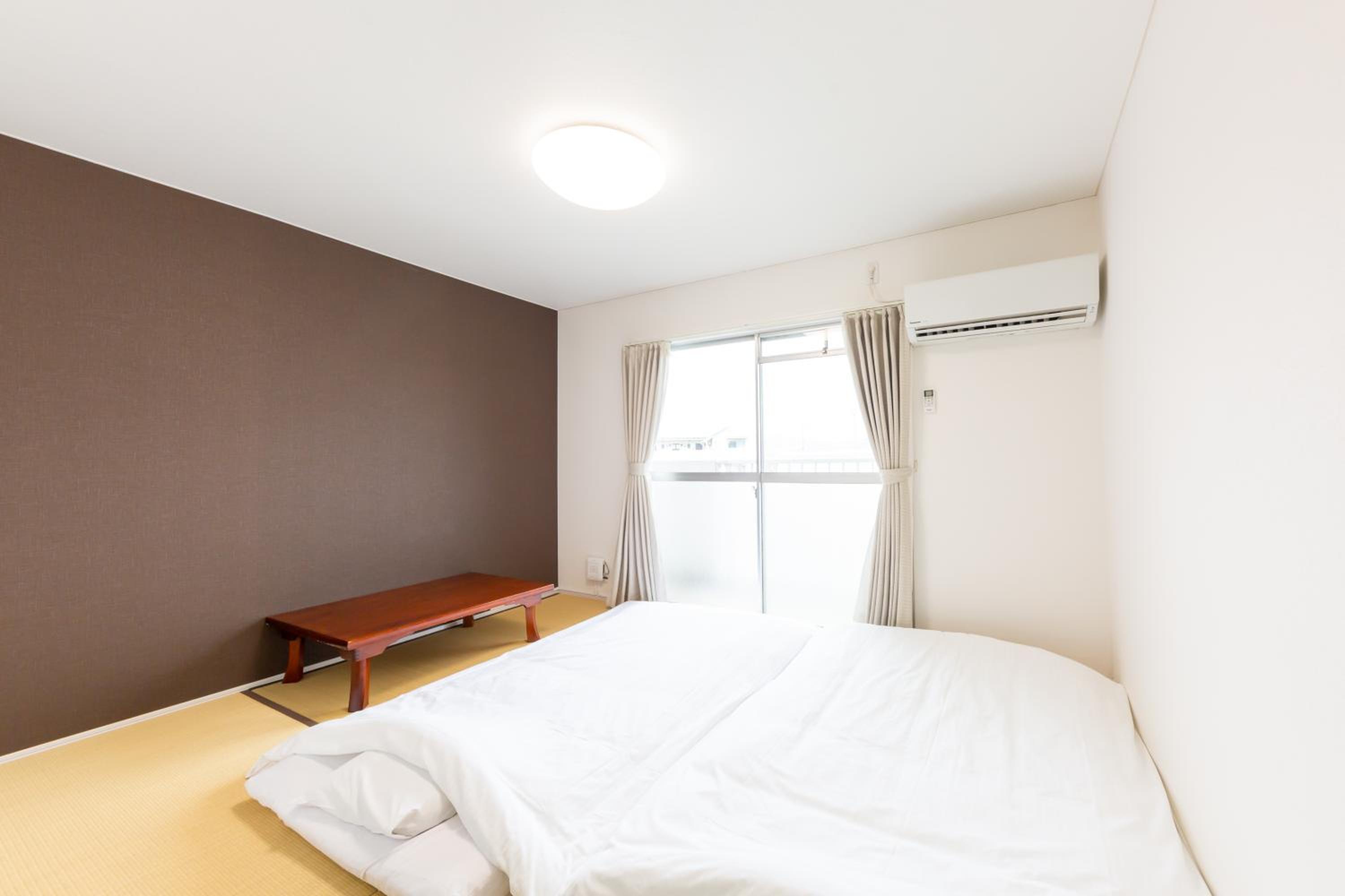 Japanese-Style Twin Room - Smoking - Photo 8