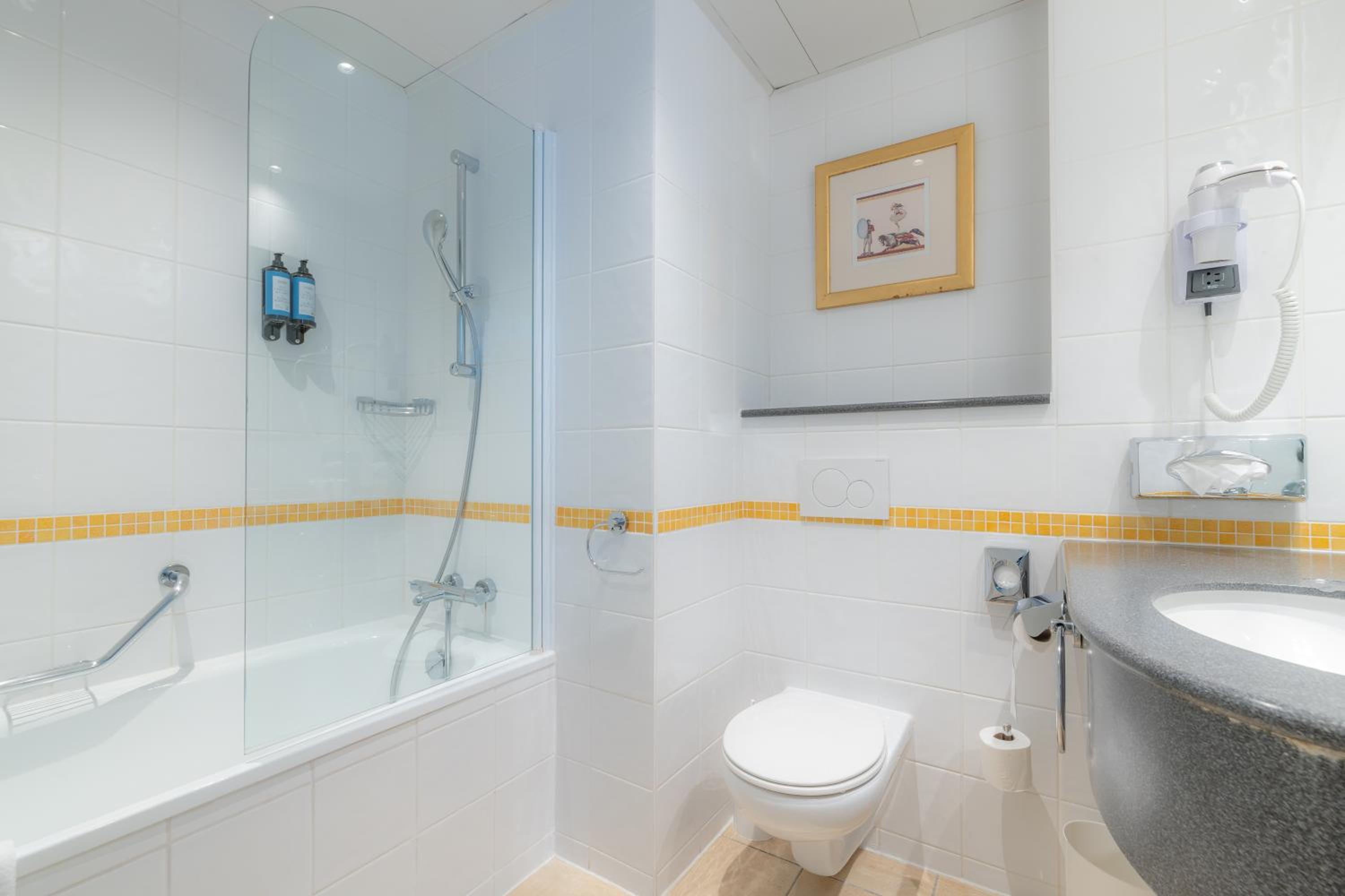 Relax in a sleek, modern bathroom oasis.
