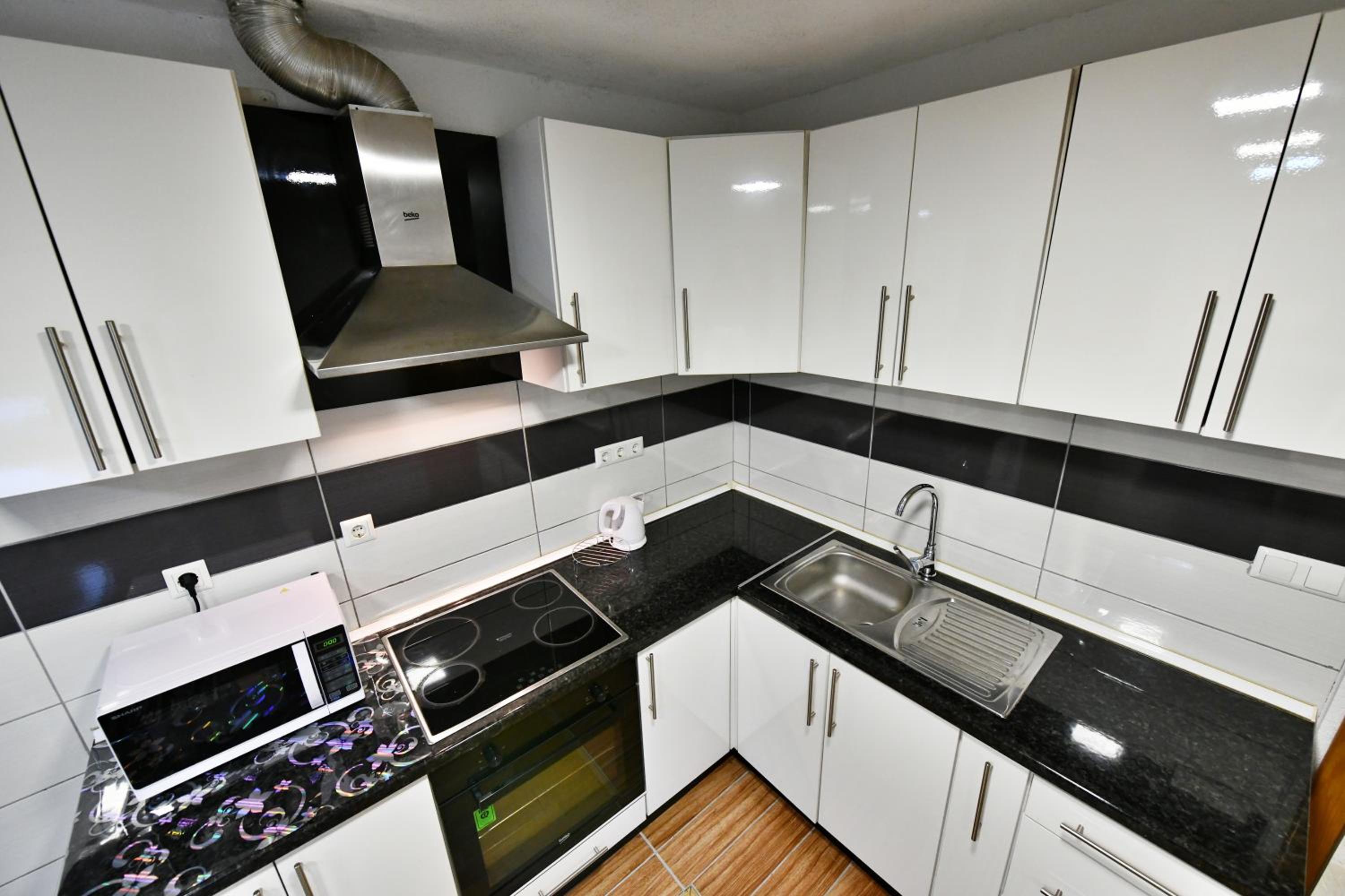 Three-Bedroom Apartment - Photo 16