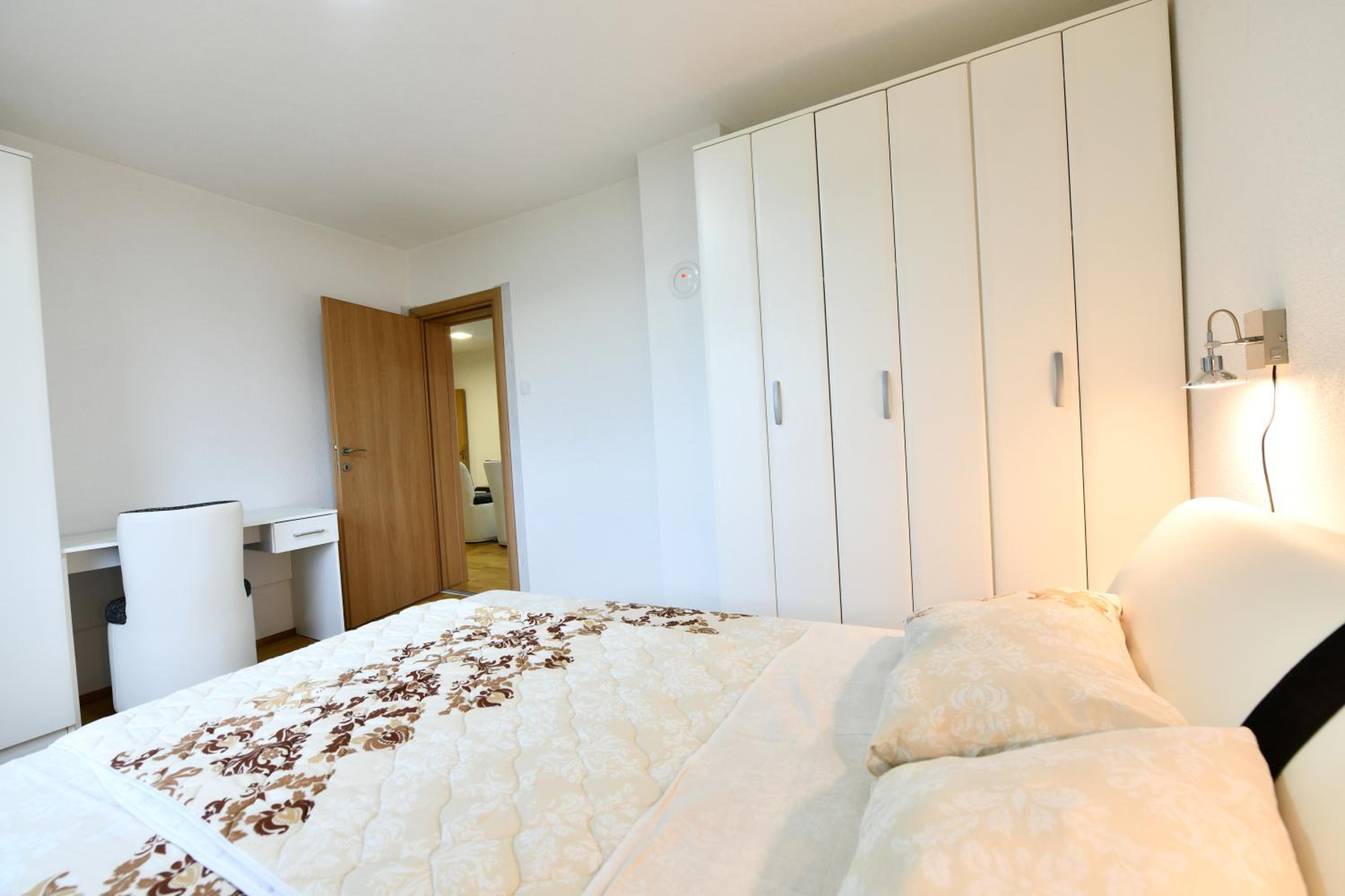 Three-Bedroom Apartment - Photo 17