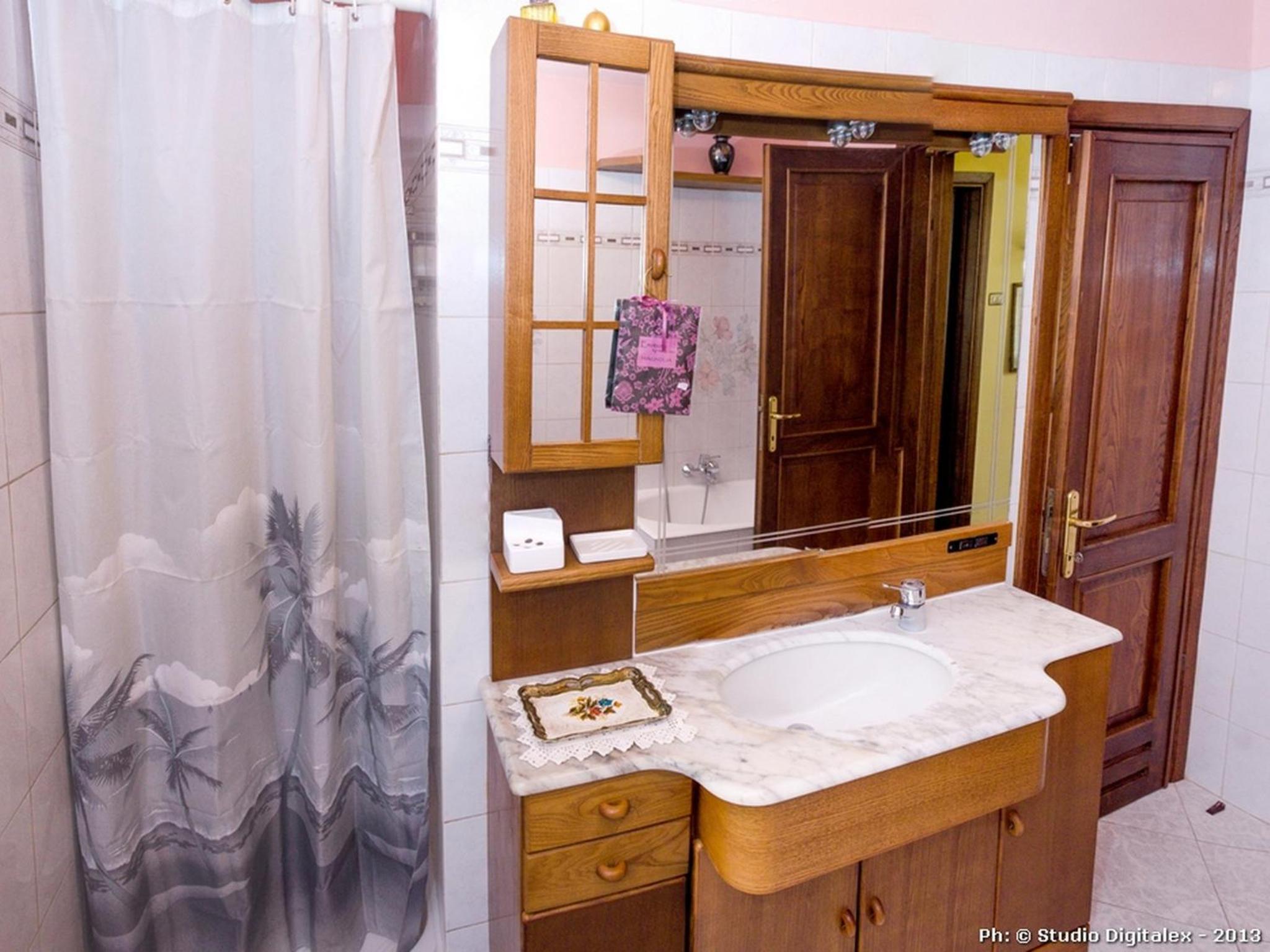 Three-Bedroom House - Photo 16