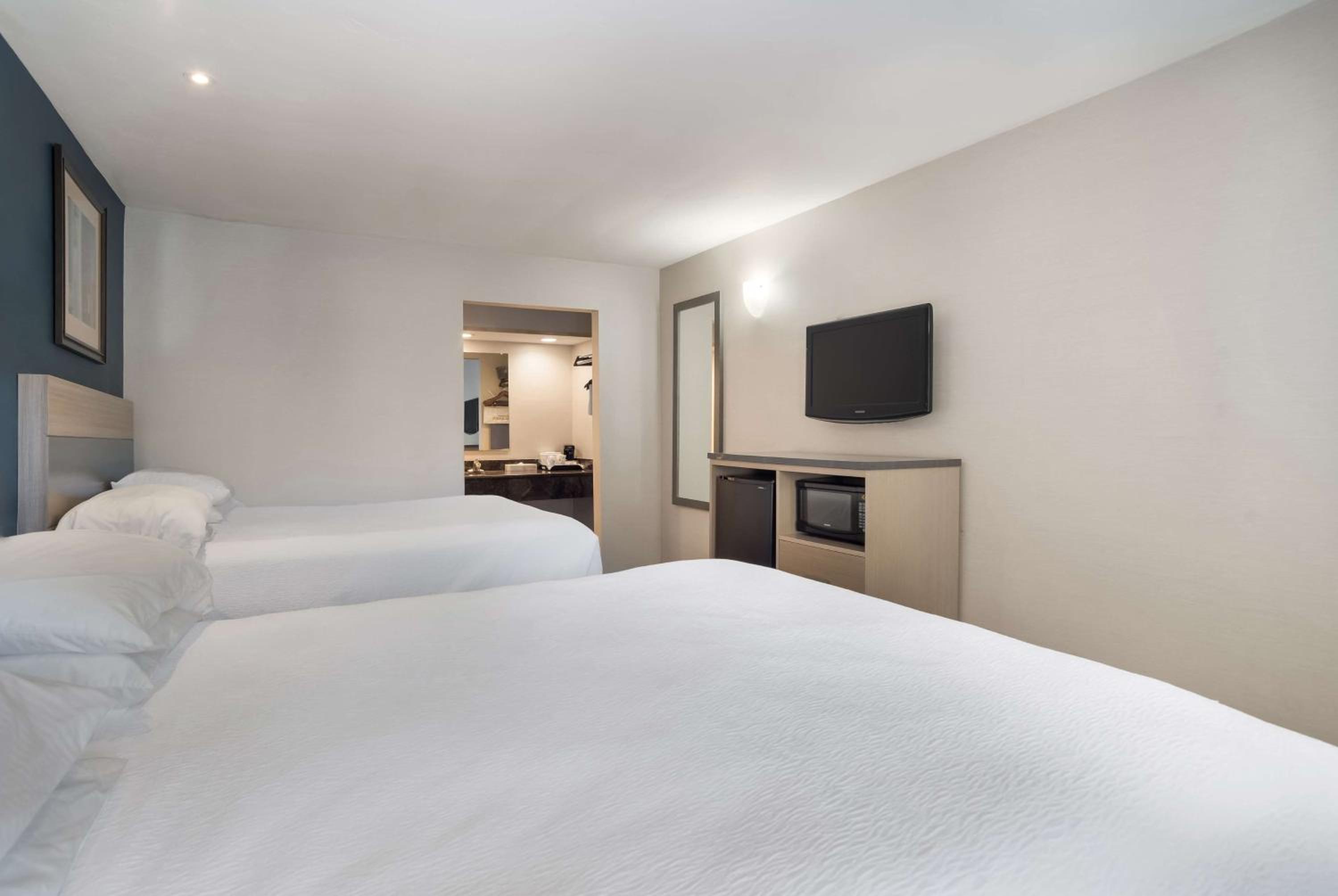 Queen Room with Two Queen Beds - Photo 1