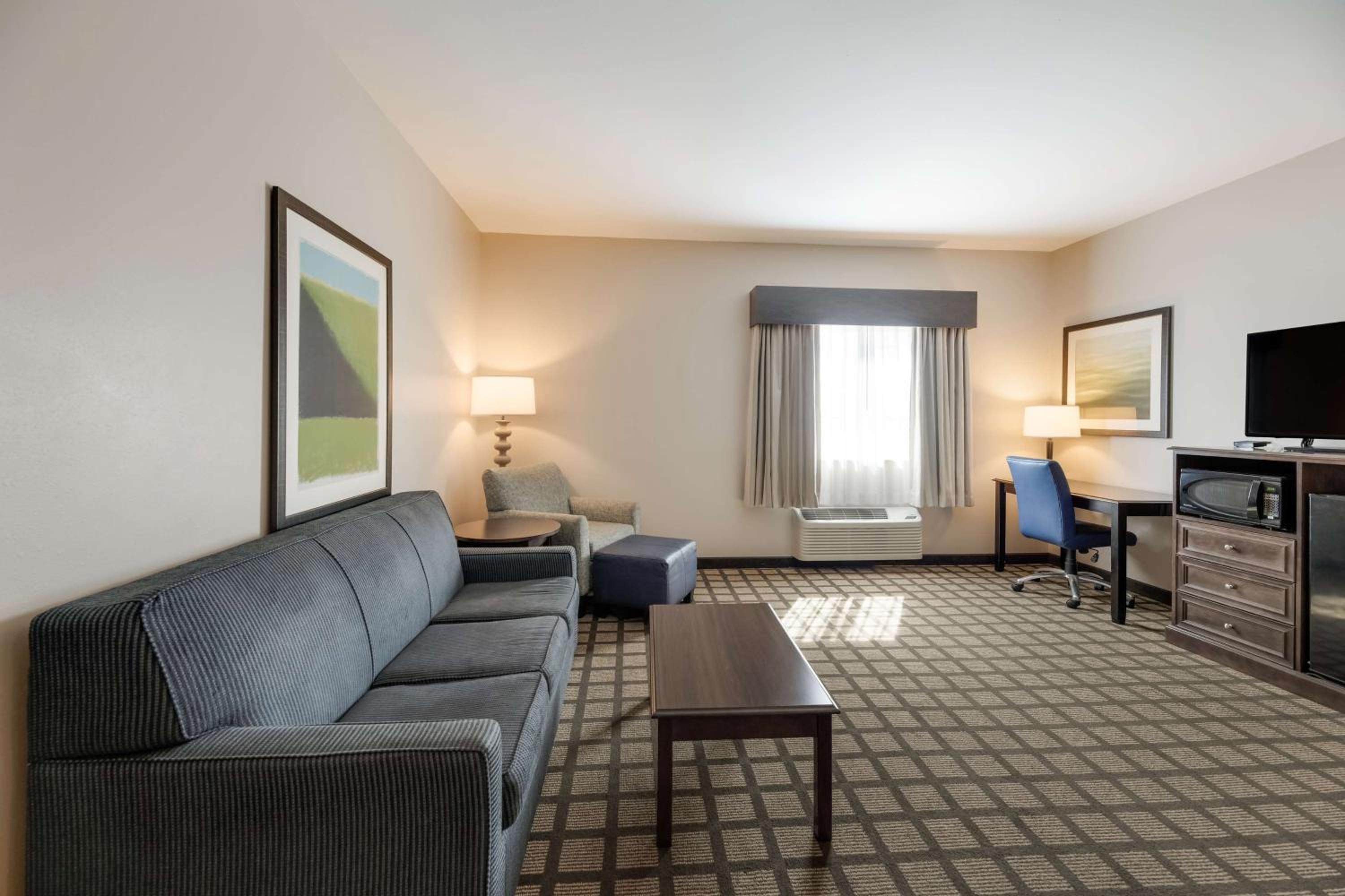 One-Bedroom King Suite with Roll-In Shower and Sofa Bed - Disability/Non-Smoking