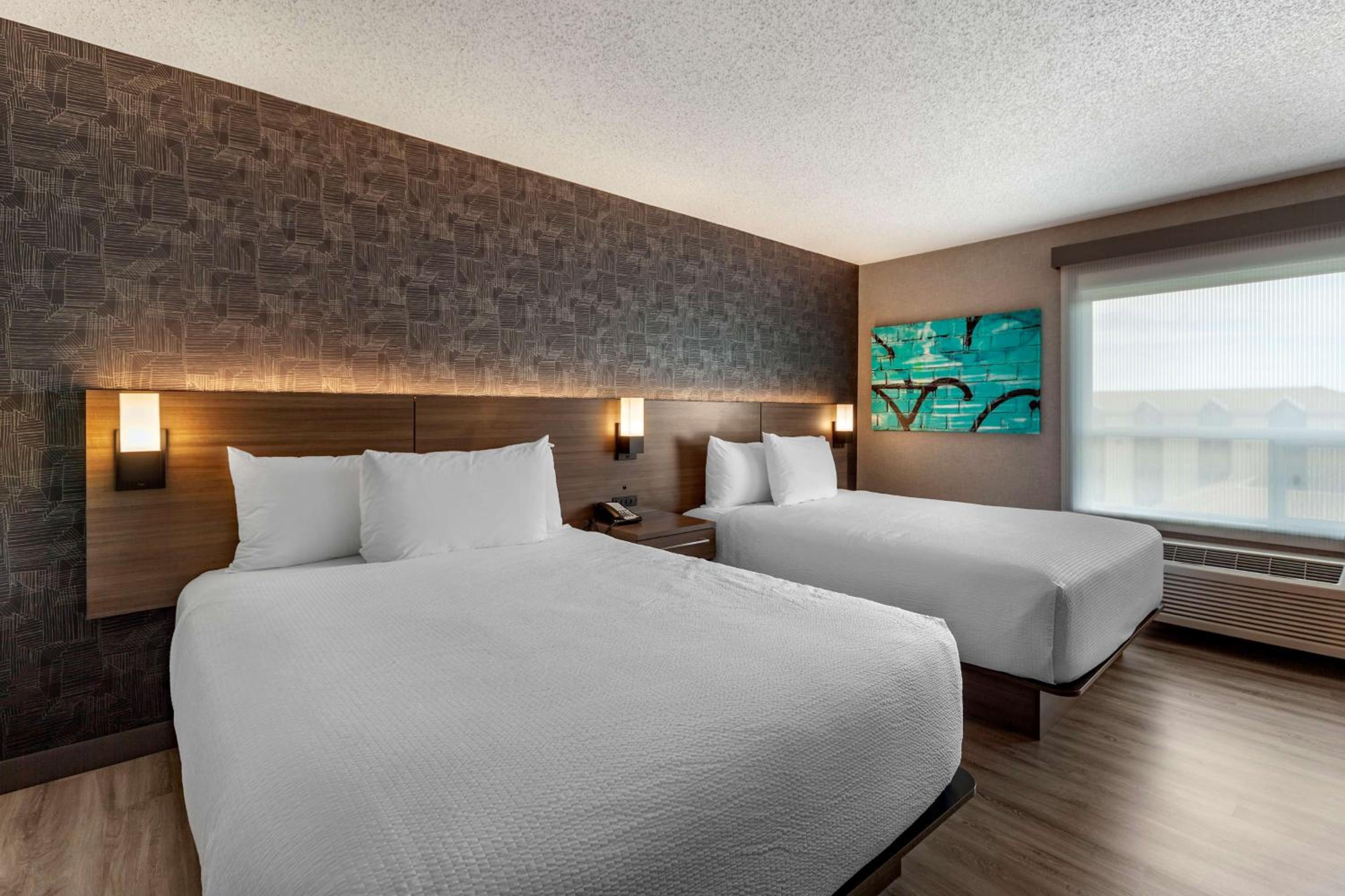 Queen Room with Two Queen Beds - Shower Only - Photo 1