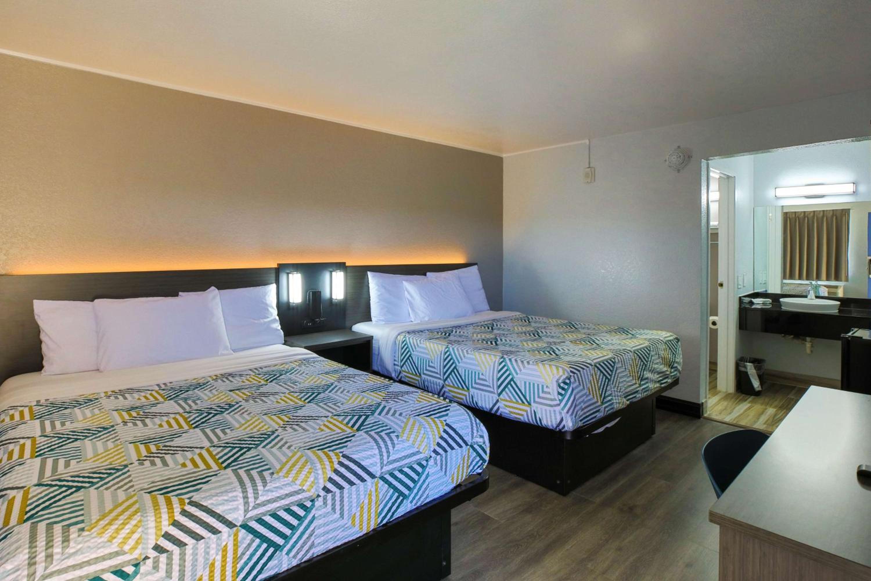 Deluxe Queen Room with Two Queen Beds - Non-Smoking photo 1