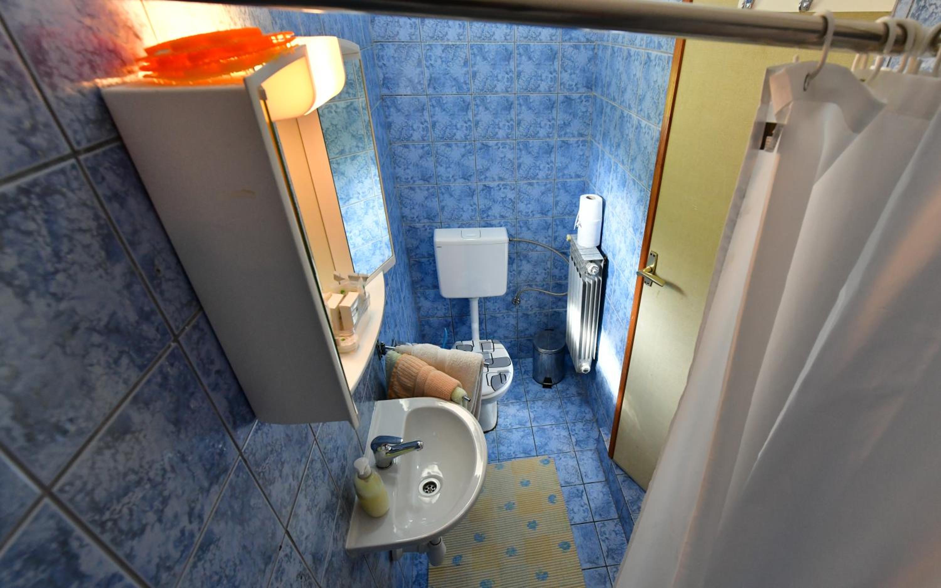 Three-Bedroom Apartment - Photo 32