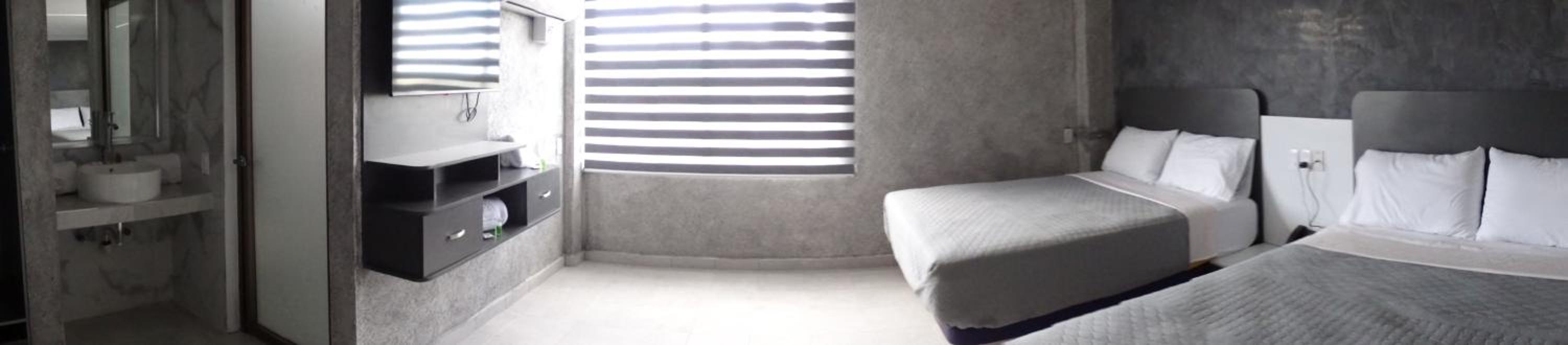 Deluxe Queen Room with Two Queen Beds - Photo 1