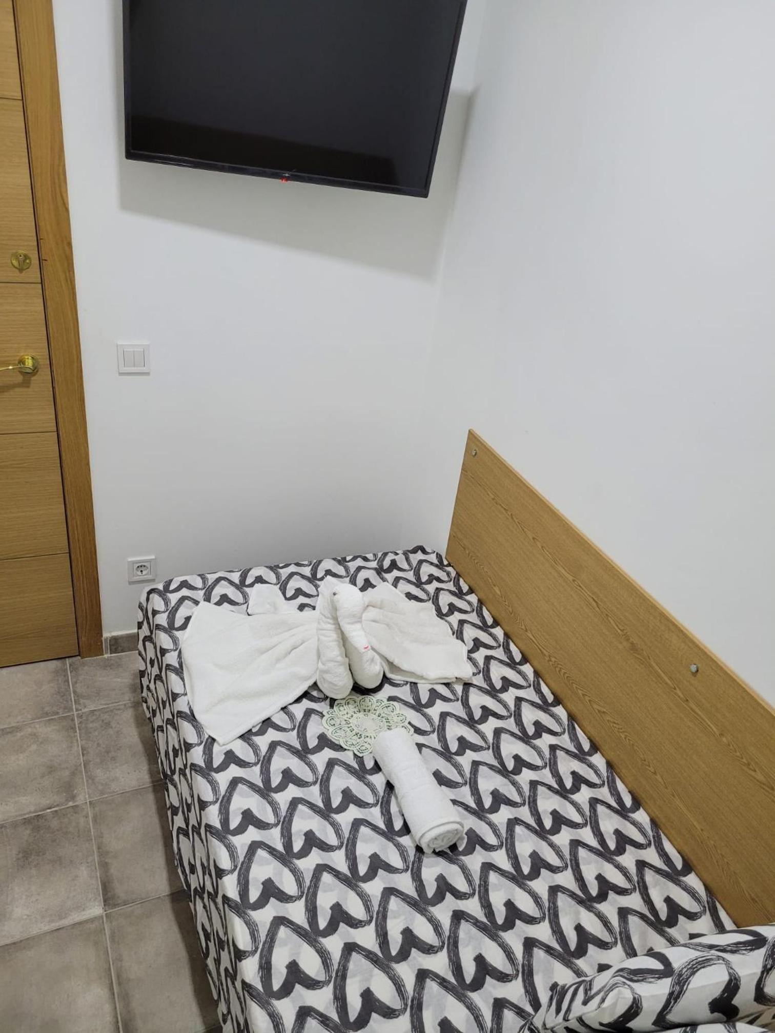 Habitación individual con baño compartido