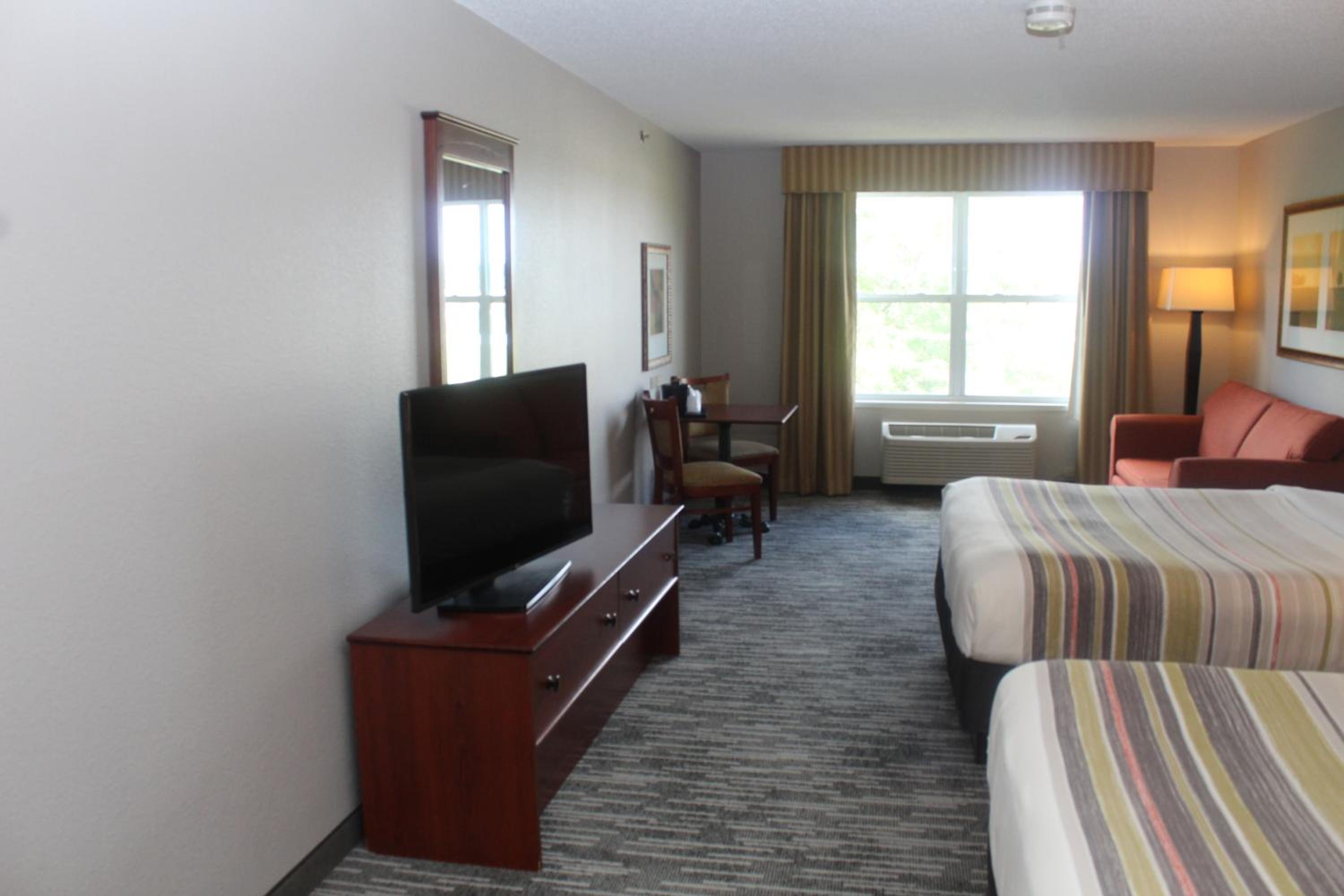 Queen Room with Two Queen Beds and Sofa Bed - Photo 2