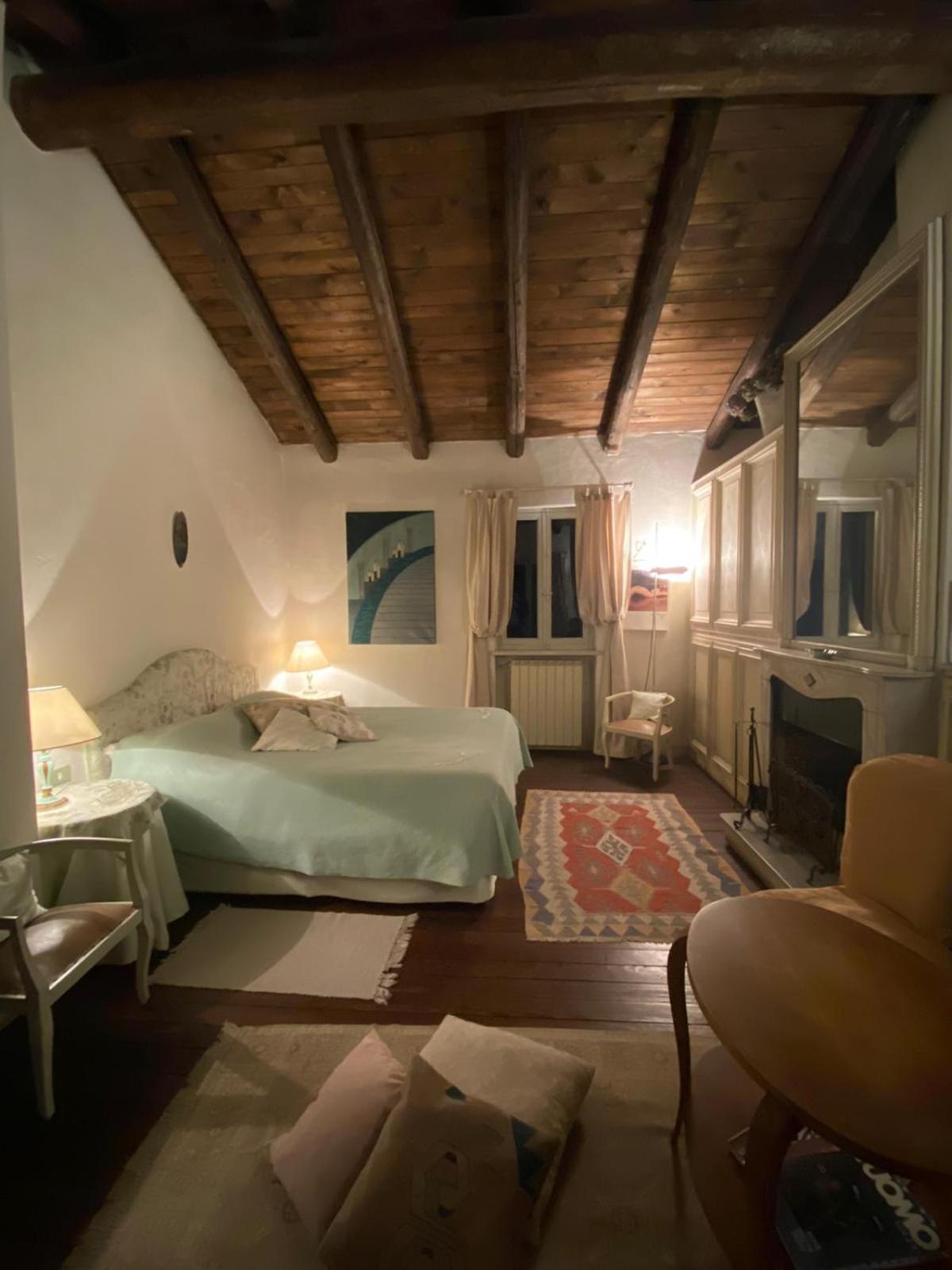 Romantic double bedroom with fireplace and small balcony photo 1