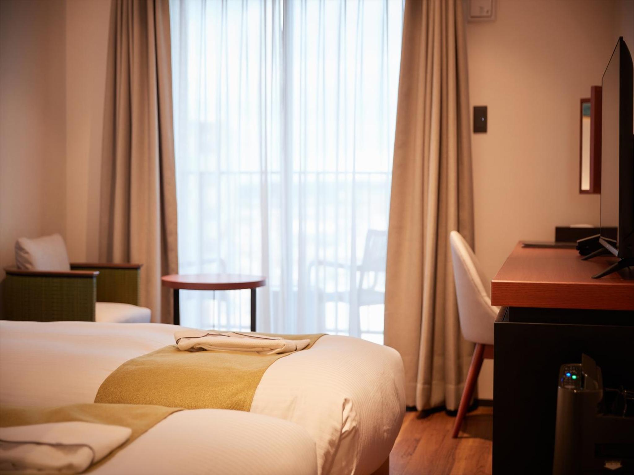 Standard Twin Room - Photo 11